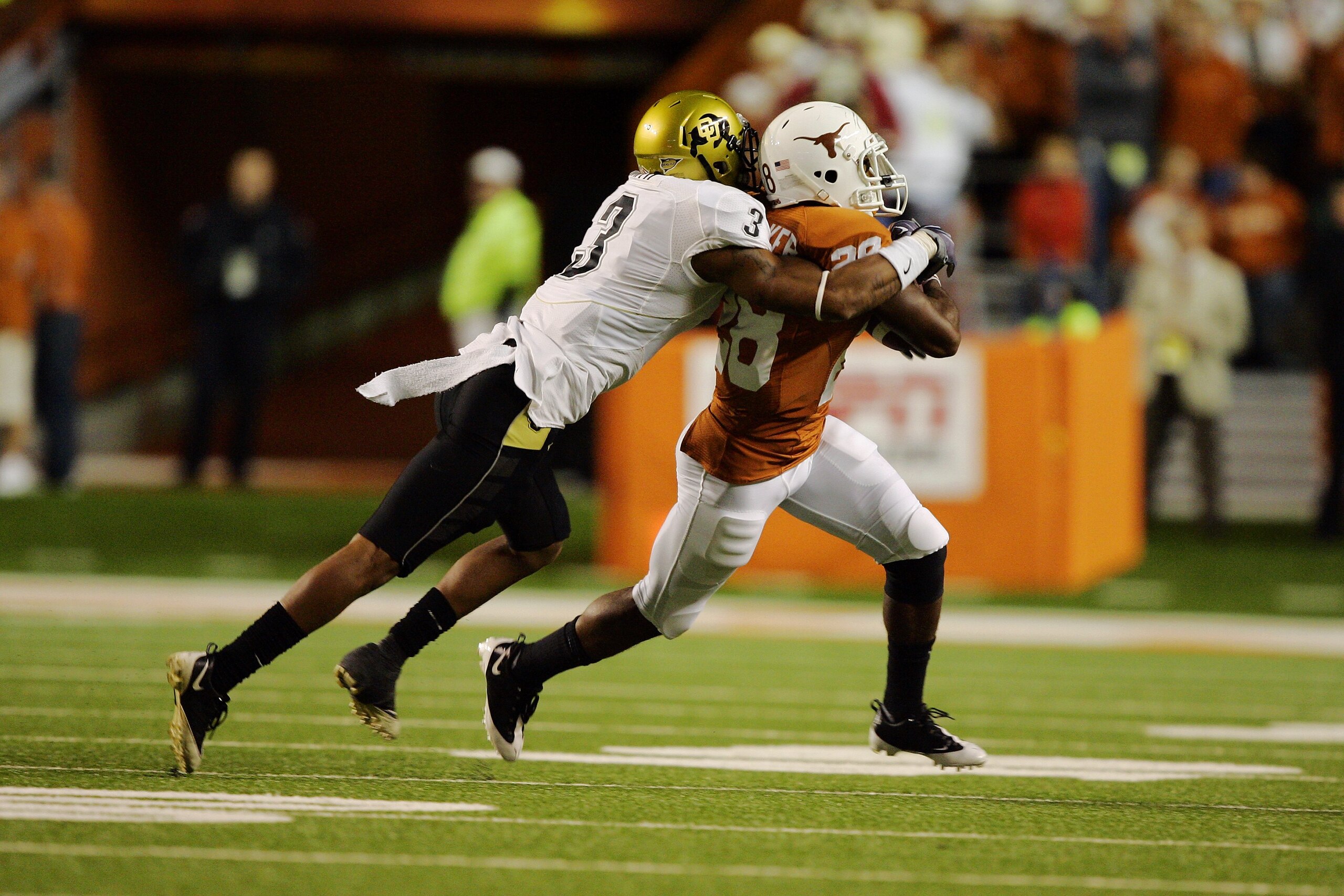 AUSTIN, TX - OCTOBER 10: Running back Fozzy Whittaker #28 of the Texas Longhorns carries the ball against cornerback Jimmy Smith #3 of the Colorado Buffaloes on October 10, 2009 at Darrell K Royal-Texas Memorial Stadium in Austin, Texas. Texas won 38-14 AUSTIN, TX - OCTOBER 10: Running back Fozzy Whittaker #28 of the Texas Longhorns carries the ball against cornerback Jimmy Smith #3 of the Colorado Buffaloes on October 10, 2009 at Darrell K Royal-Texas Memorial Stadium in Austin, Texas. Texas won 38-14
