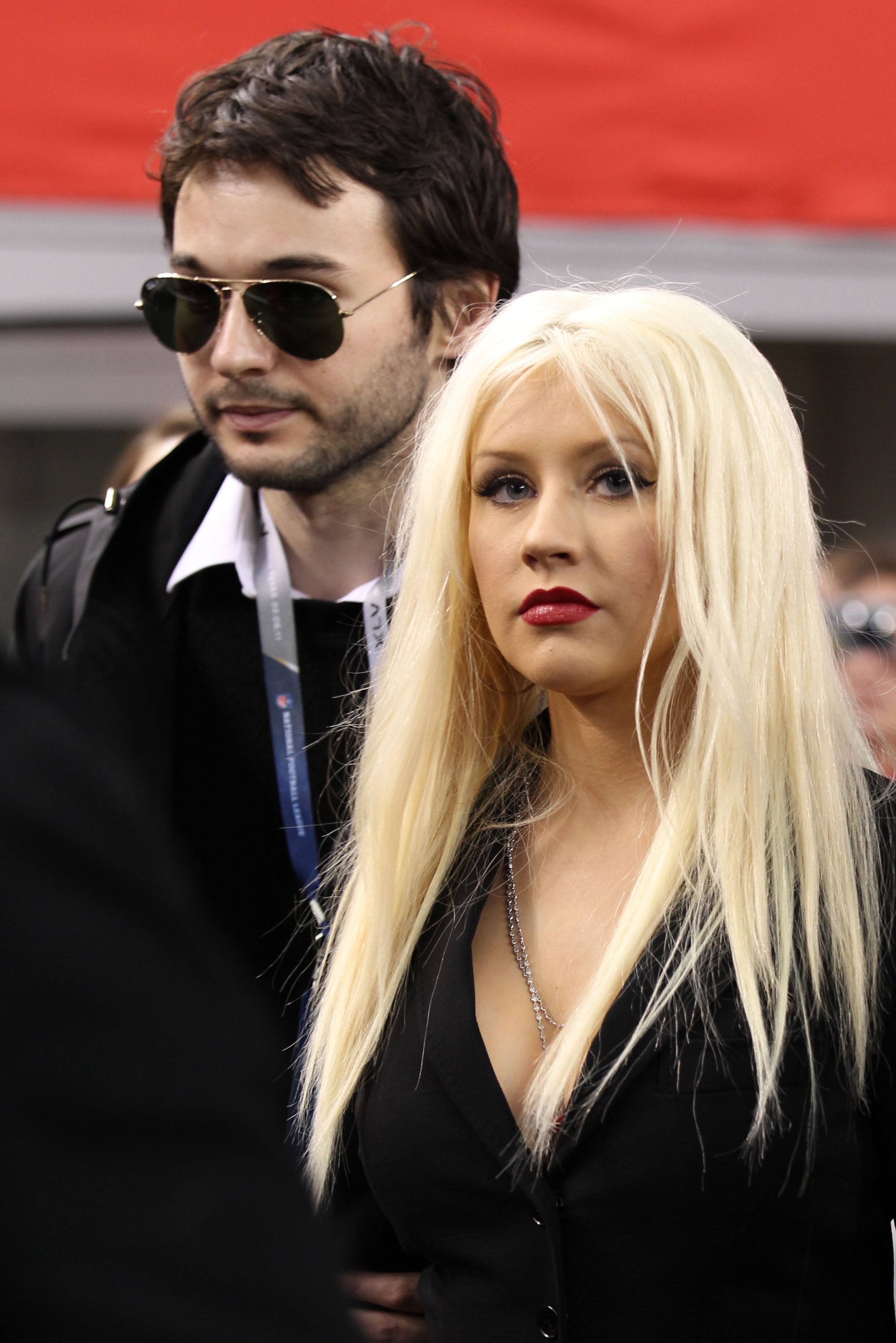 ARLINGTON, TX - FEBRUARY 06:  Singer Christina Aguilera (R) and Matthew Rutler attend the Bridgestone Super Bowl XLV Pregame Show at Dallas Cowboys Stadium on February 6, 2011 in Arlington, Texas.  (Photo by Christopher Polk/Getty Images)