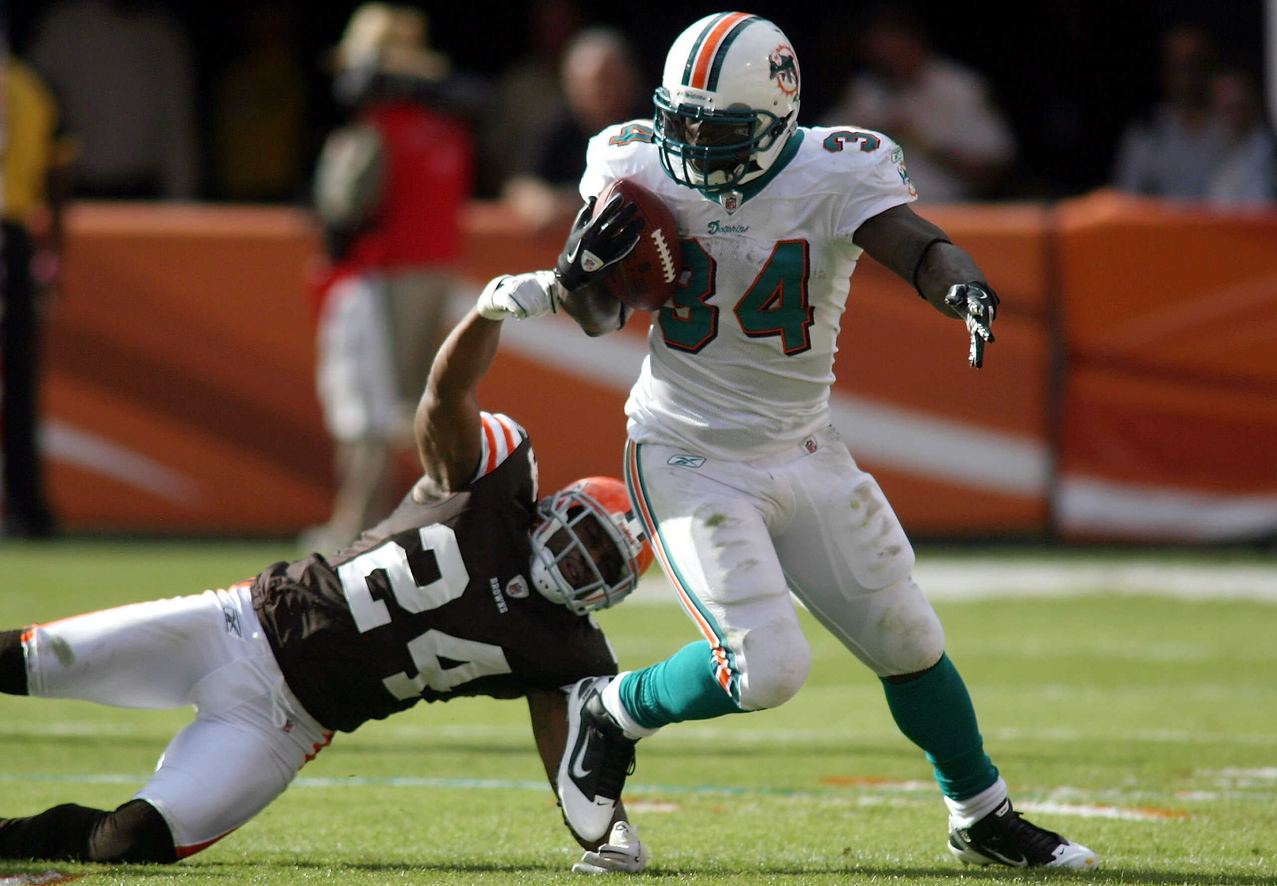 MIAMI - DECEMBER 05: Running back Ricky Williams #34 of the Miami Dolphins is brought down by Sheldon Brown #24 of the Cleveland Browns at Sun Life Stadium on December 5, 2010 in Miami, Florida. (Photo by Marc Serota/Getty Images) MIAMI - DECEMBER 05: Running back Ricky Williams #34 of the Miami Dolphins is brought down by Sheldon Brown #24 of the Cleveland Browns at Sun Life Stadium on December 5, 2010 in Miami, Florida. (Photo by Marc Serota/Getty Images)