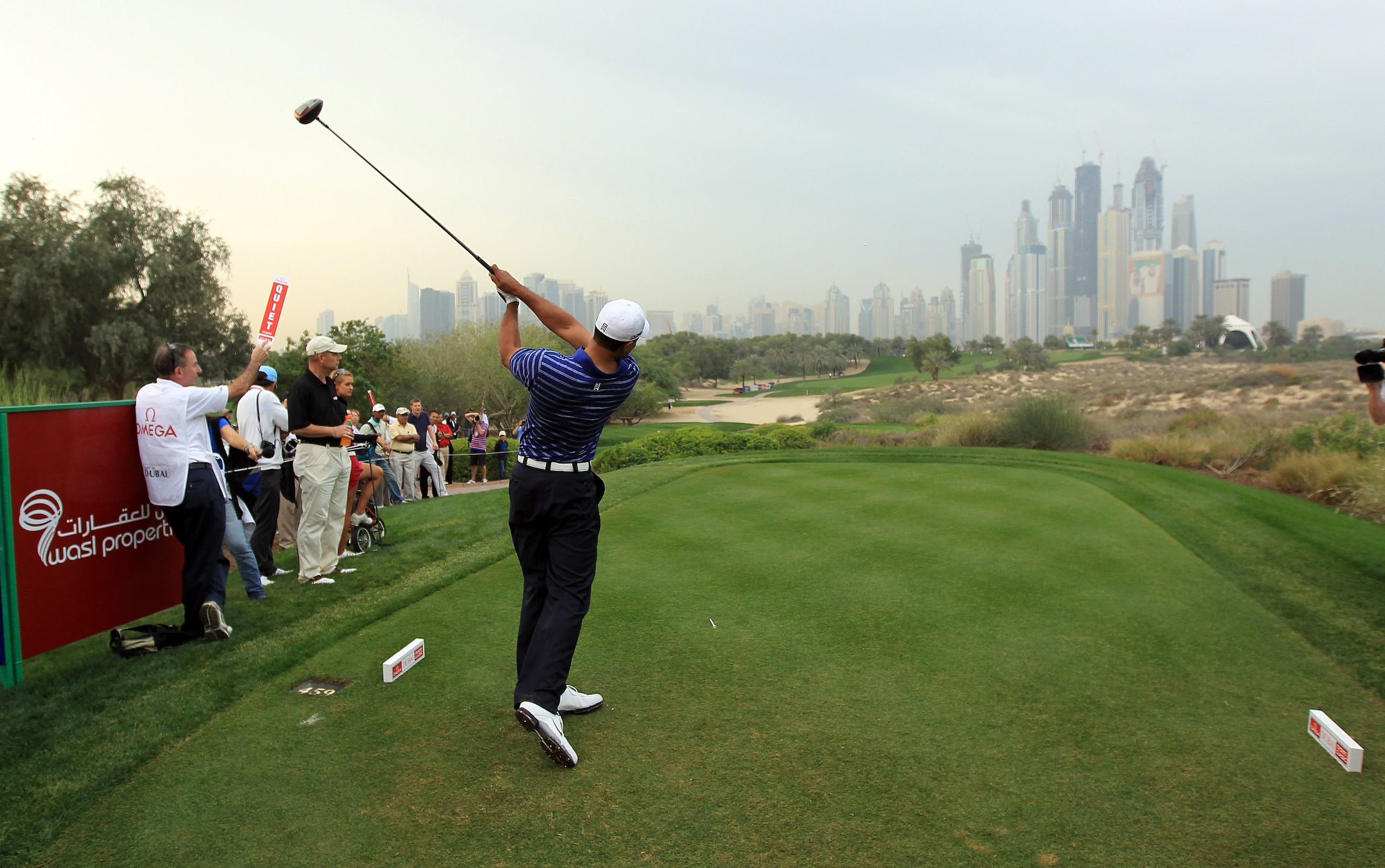 DUBAI, UNITED ARAB EMIRATES - FEBRUARY 09:  Tiger Woods of the USA in action during the pro-am for the 2011 Omega Dubai desert Classic held on the Majilis Course at the Emirates Golf Club on February 9, 2011 in Dubai, United Arab Emirates.  (Photo by Davi