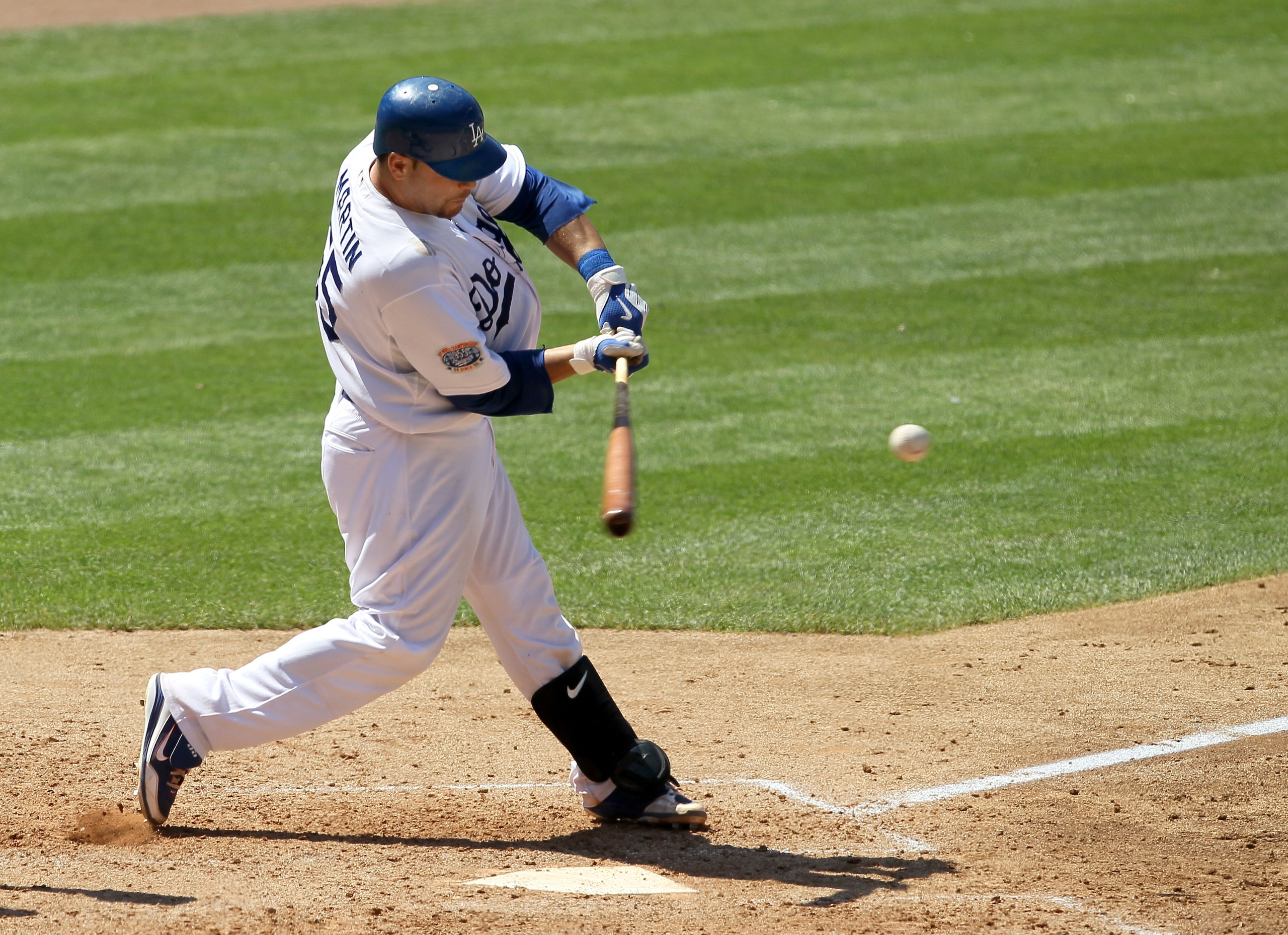 LOS ANGELES, CA - JULY 25:  Russell Martin #55 of the Los Angeles Dodgers hits an RBI double which accounts for the game's only run in the eighth nning against the New York Mets on July 25, 2010 at Dodger Stadium in Los Angeles, California.   The Dodgers