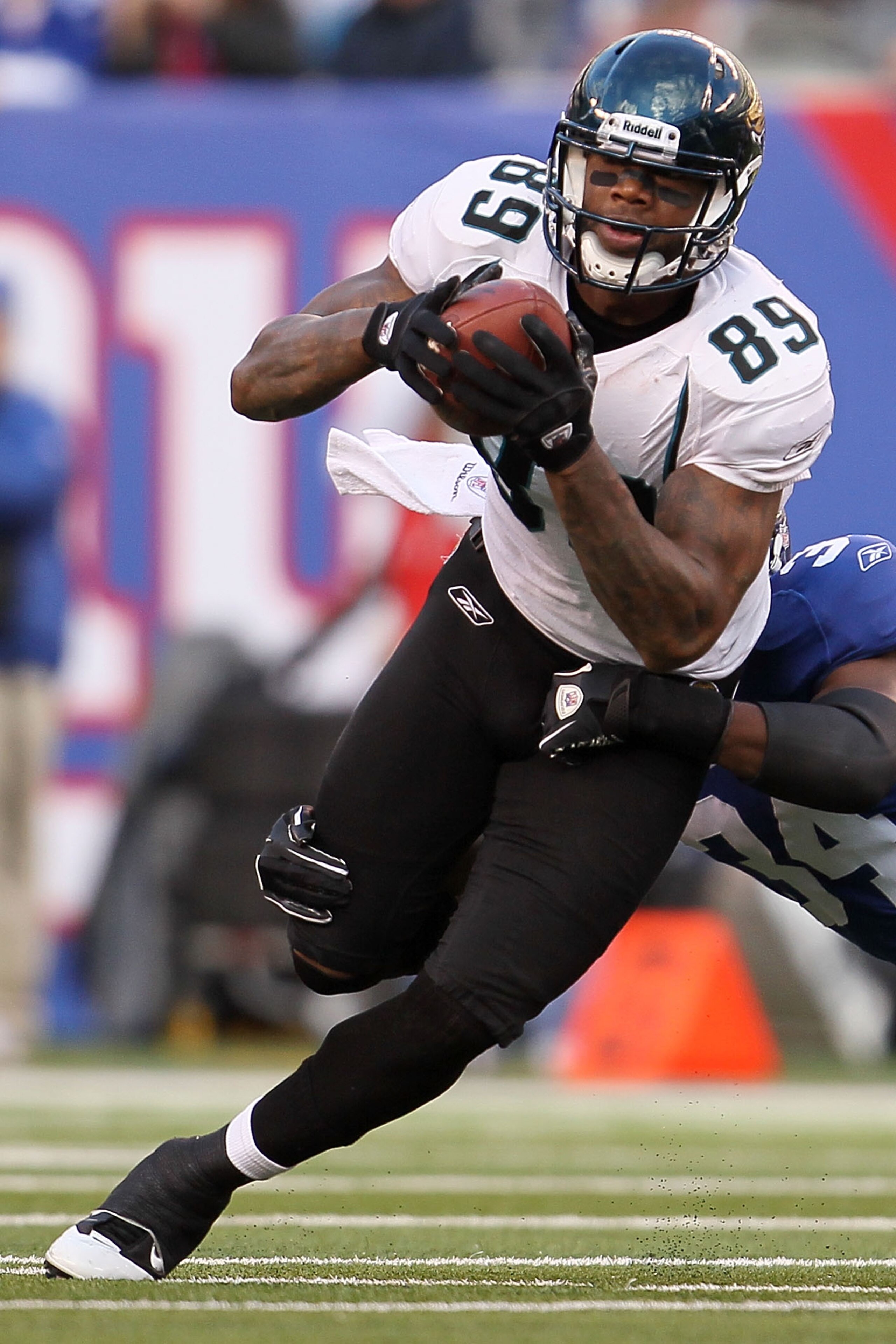 EAST RUTHERFORD, NJ - NOVEMBER 28: Marcedes Lewis #89 of the Jacksonville Jaguars tries to break out of a tackle against the New York Giants at New Meadowlands Stadium on November 28, 2010 in East Rutherford, New Jersey. (Photo by Chris McGrath/Getty Ima EAST RUTHERFORD, NJ - NOVEMBER 28: Marcedes Lewis #89 of the Jacksonville Jaguars tries to break out of a tackle against the New York Giants at New Meadowlands Stadium on November 28, 2010 in East Rutherford, New Jersey. (Photo by Chris McGrath/Getty Ima