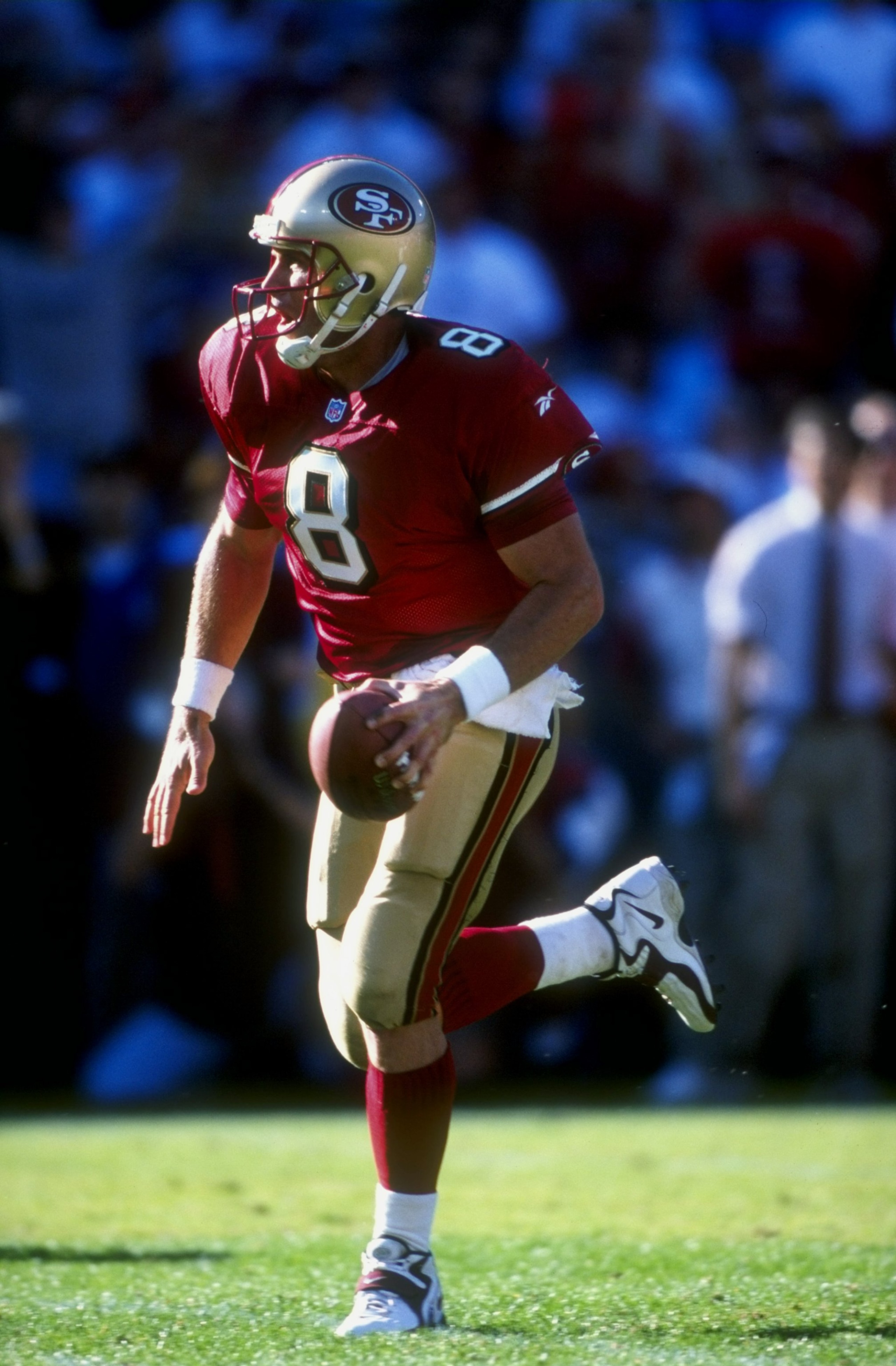 18 Oct 1998: Quarterback Steve Young #8 of the San Francisco 49ers runs as he looks to throw during the game against the Indianapolis Colts at 3Com Park in San Francisco, California. The 49ers defeated the Colts 34-31.