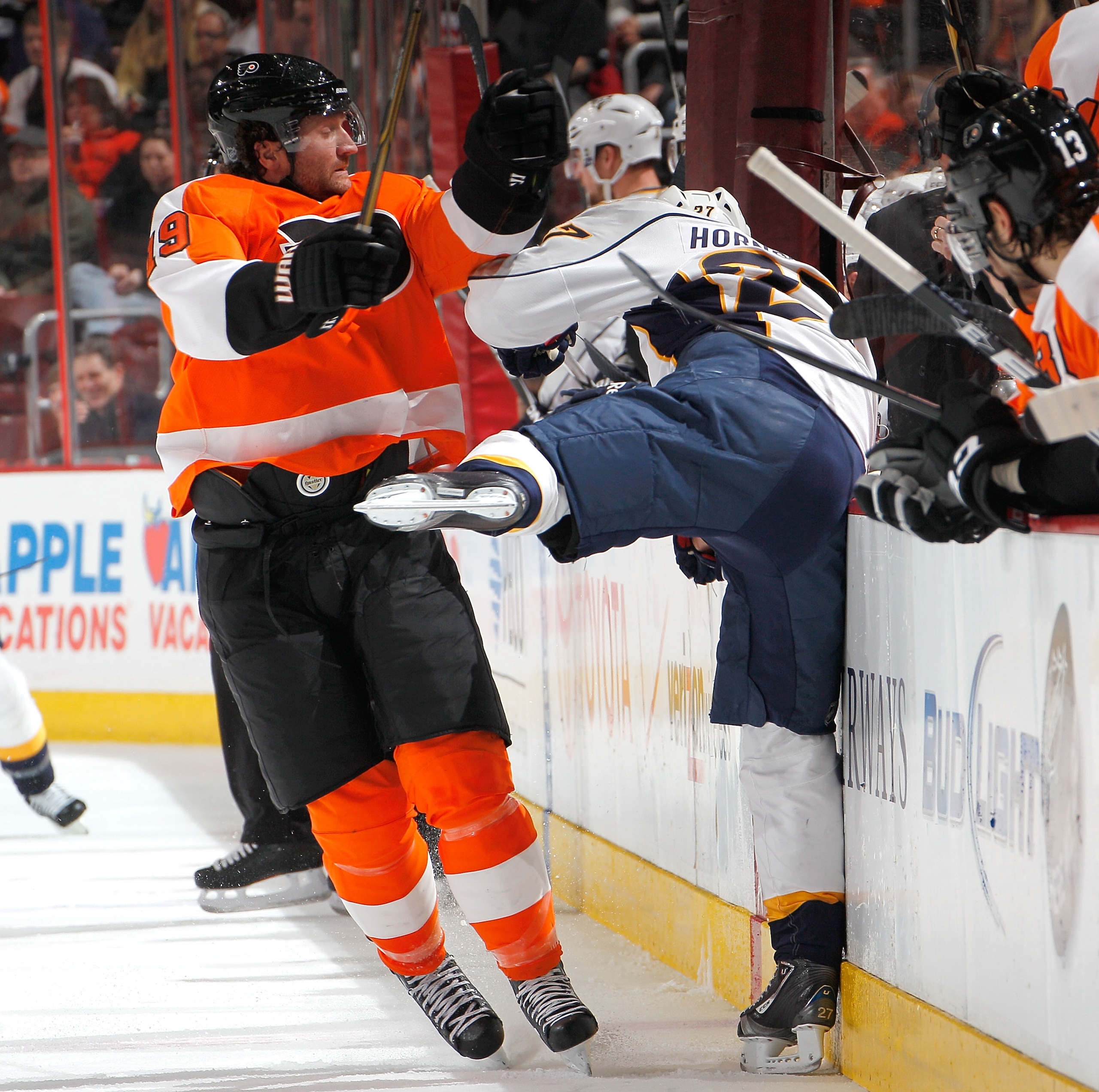 PHILADELPHIA, PA - FEBRUARY 03: Patric Hornqvist #27 of the Nashville Predators is checked into the boards by Scott Hartnell #19 of the Philadelphia Flyers during the first period of an NHL hockey game at the Wells Fargo Center on February 3, 2011 in Phi PHILADELPHIA, PA - FEBRUARY 03: Patric Hornqvist #27 of the Nashville Predators is checked into the boards by Scott Hartnell #19 of the Philadelphia Flyers during the first period of an NHL hockey game at the Wells Fargo Center on February 3, 2011 in Phi
