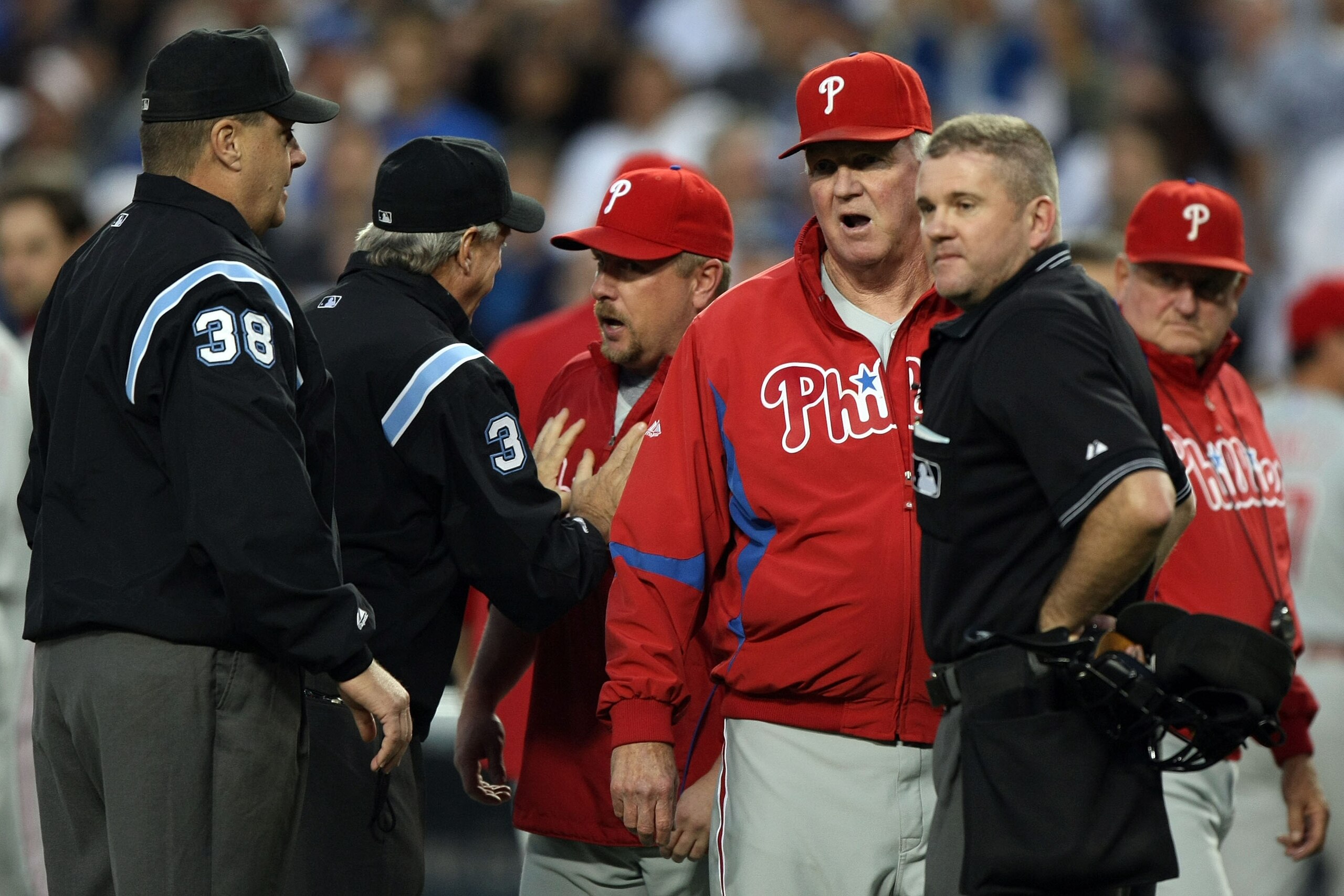 LOS ANGELES, CA - OCTOBER 12:  The umpires talk to manager (M) Charlie Manuel after the benches cleared in the third inning against the Los Angeles Dodgers in Game Three of the National League Championship Series during the 2008 MLB playoffs on October 12