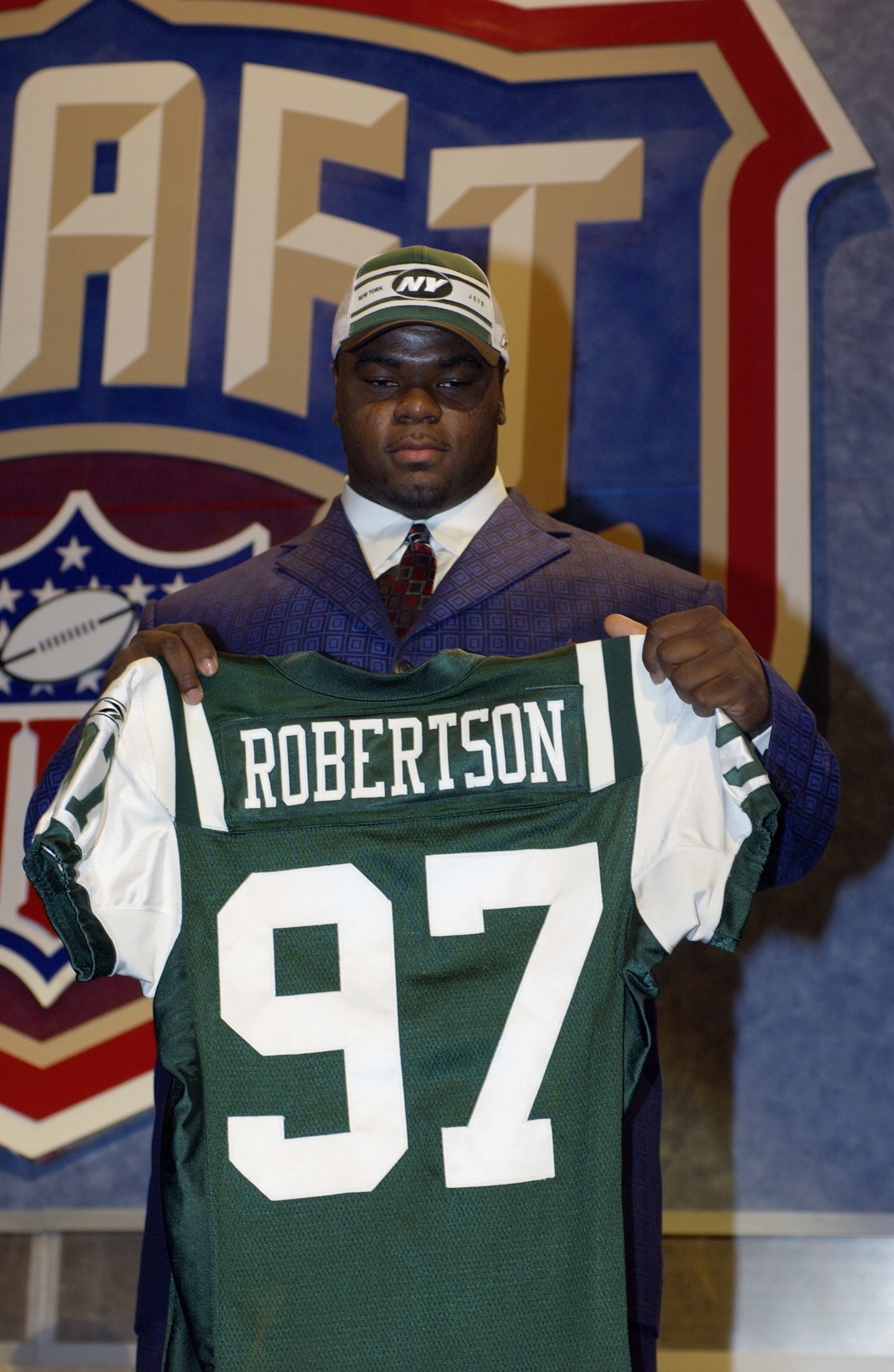 NEW YORK CITY - APRIL 26: Dewayne Robertson from Kentucky after he was selected fourth overall by the New York Jets at the 2003 NFL Draft on April 26, 2003 at Madison Square Garden in New York City.. (Photo by Ezra Shaw/Getty Images) NEW YORK CITY - APRIL 26: Dewayne Robertson from Kentucky after he was selected fourth overall by the New York Jets at the 2003 NFL Draft on April 26, 2003 at Madison Square Garden in New York City.. (Photo by Ezra Shaw/Getty Images)