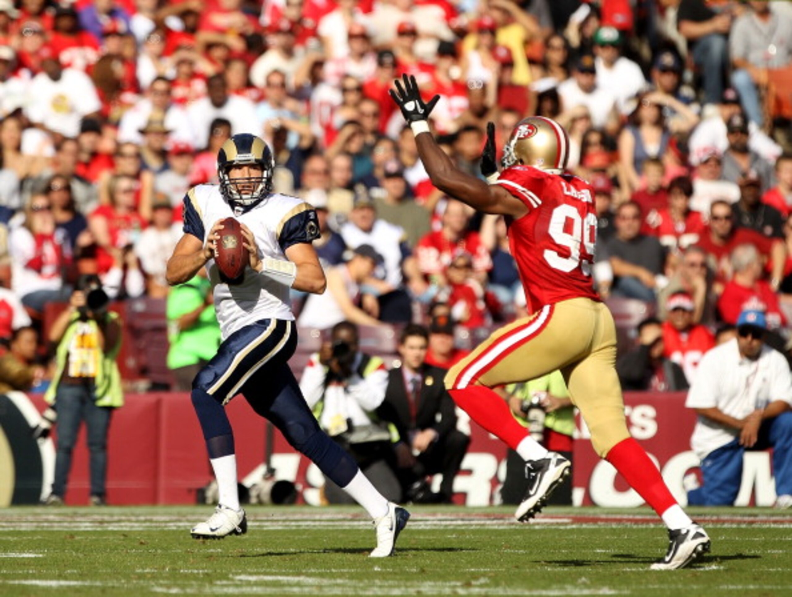 SAN FRANCISCO - NOVEMBER 14: Sam Bradford #8 of the St. Louis Rams is chased by Manny Lawson #99 of the San Francisco 49ers at Candlestick Park on November 14, 2010 in San Francisco, California. (Photo by Ezra Shaw/Getty Images) SAN FRANCISCO - NOVEMBER 14: Sam Bradford #8 of the St. Louis Rams is chased by Manny Lawson #99 of the San Francisco 49ers at Candlestick Park on November 14, 2010 in San Francisco, California. (Photo by Ezra Shaw/Getty Images)