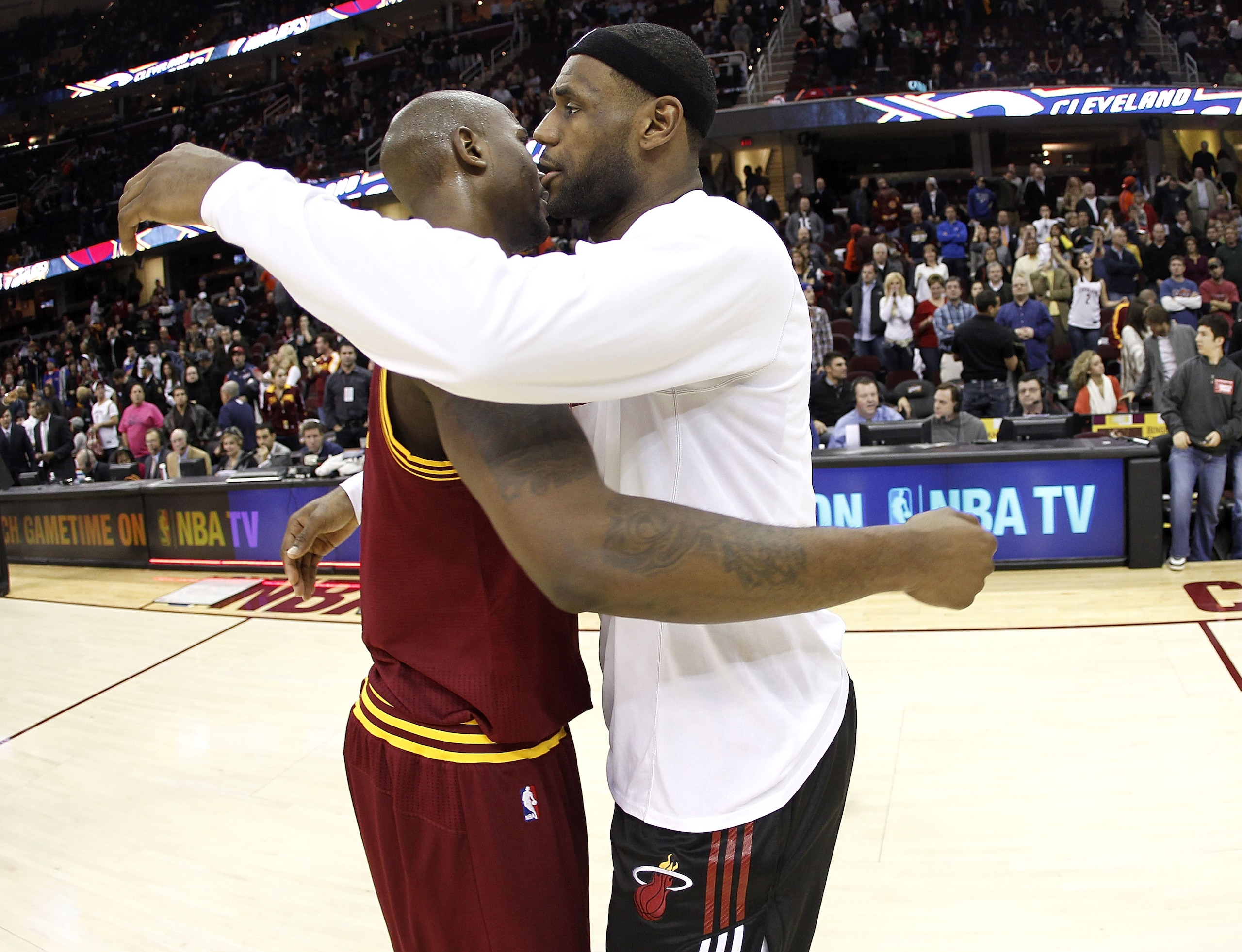 CLEVELAND, OH - DECEMBER 02:  LeBron James #6 of the Miami Heat hugs Jawad Williams after a 118-90 victory over the Cleveland Cavaliers at Quicken Loans Arena on December 2, 2010 in Cleveland, Ohio. NOTE TO USER: User expressly acknowledges and agrees tha
