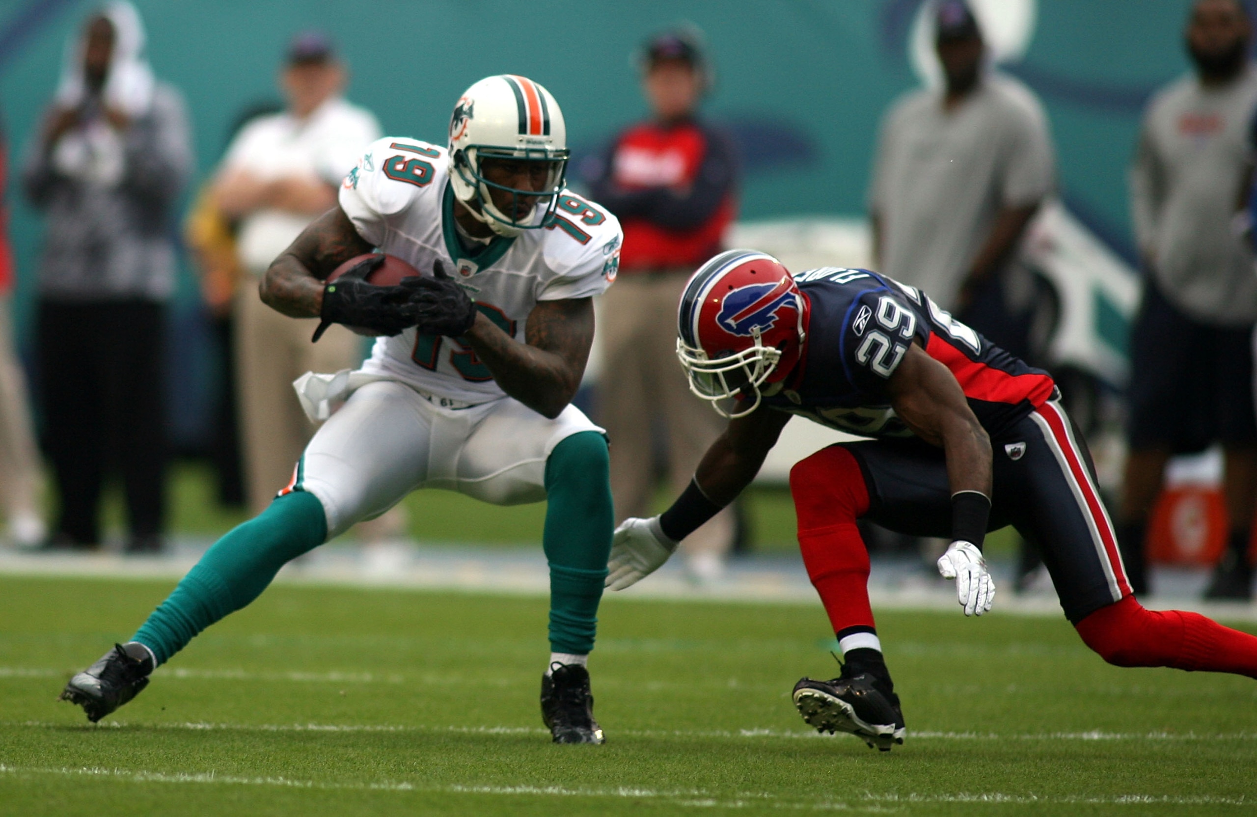 MIAMI - DECEMBER 19: Receiver Brandon Marshall #19 of the Miami Dolphins makes a catch against the Buffalo Bills at Sun Life Stadium on December 19, 2010 in Miami, Florida. The Bills defeated the Dolphins 17-14. (Photo by Marc Serota/Getty Images) MIAMI - DECEMBER 19: Receiver Brandon Marshall #19 of the Miami Dolphins makes a catch against the Buffalo Bills at Sun Life Stadium on December 19, 2010 in Miami, Florida. The Bills defeated the Dolphins 17-14. (Photo by Marc Serota/Getty Images)