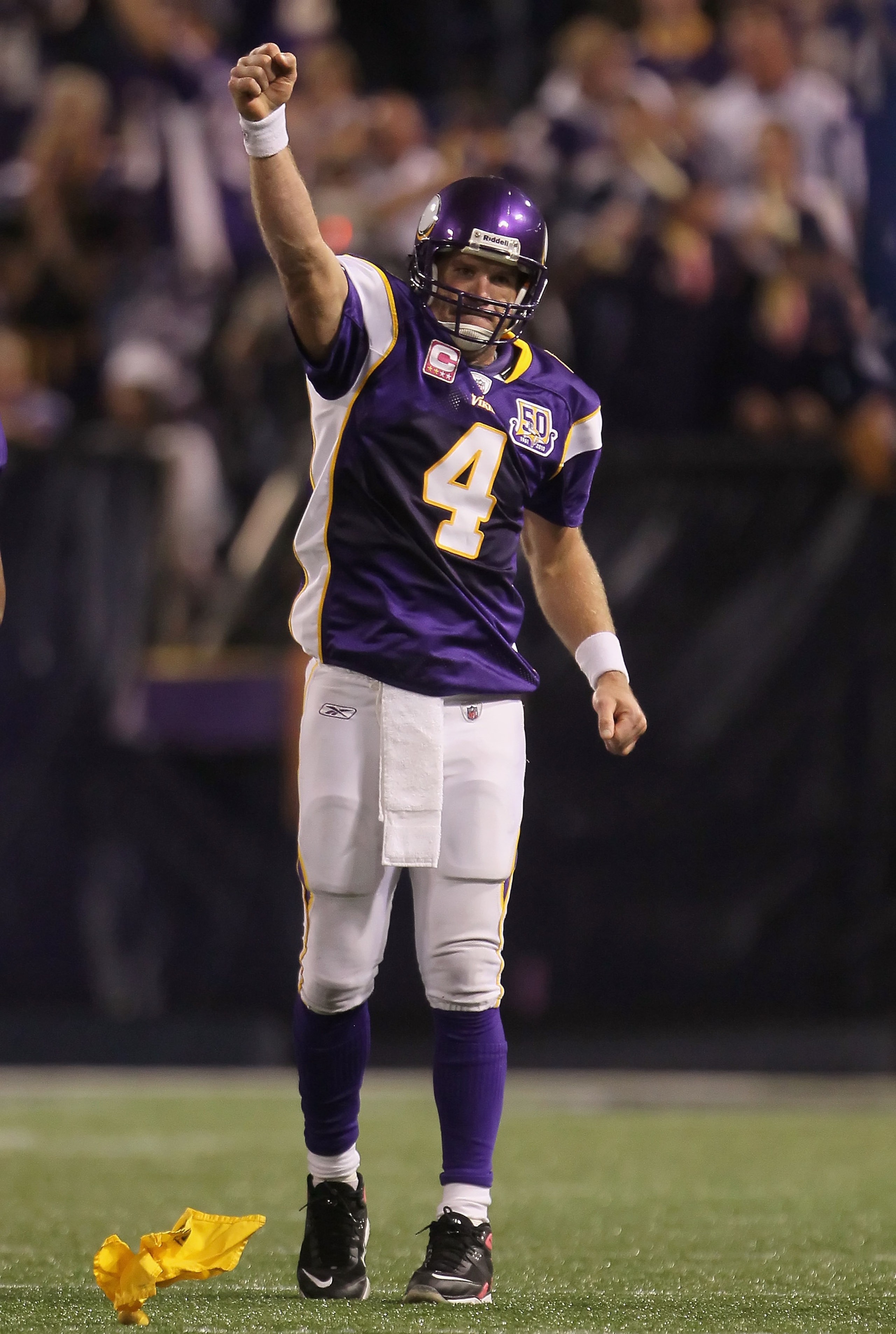 MINNEAPOLIS - OCTOBER 17: Quarterback Brett Favre #4 of the Minnesota Vikings celebrates a pass interference call against Mike Jenkins (not pictured) of the Dallas Cowboys during the fourth quarter at Mall of America Field on October 17, 2010 in Minneapo MINNEAPOLIS - OCTOBER 17: Quarterback Brett Favre #4 of the Minnesota Vikings celebrates a pass interference call against Mike Jenkins (not pictured) of the Dallas Cowboys during the fourth quarter at Mall of America Field on October 17, 2010 in Minneapo