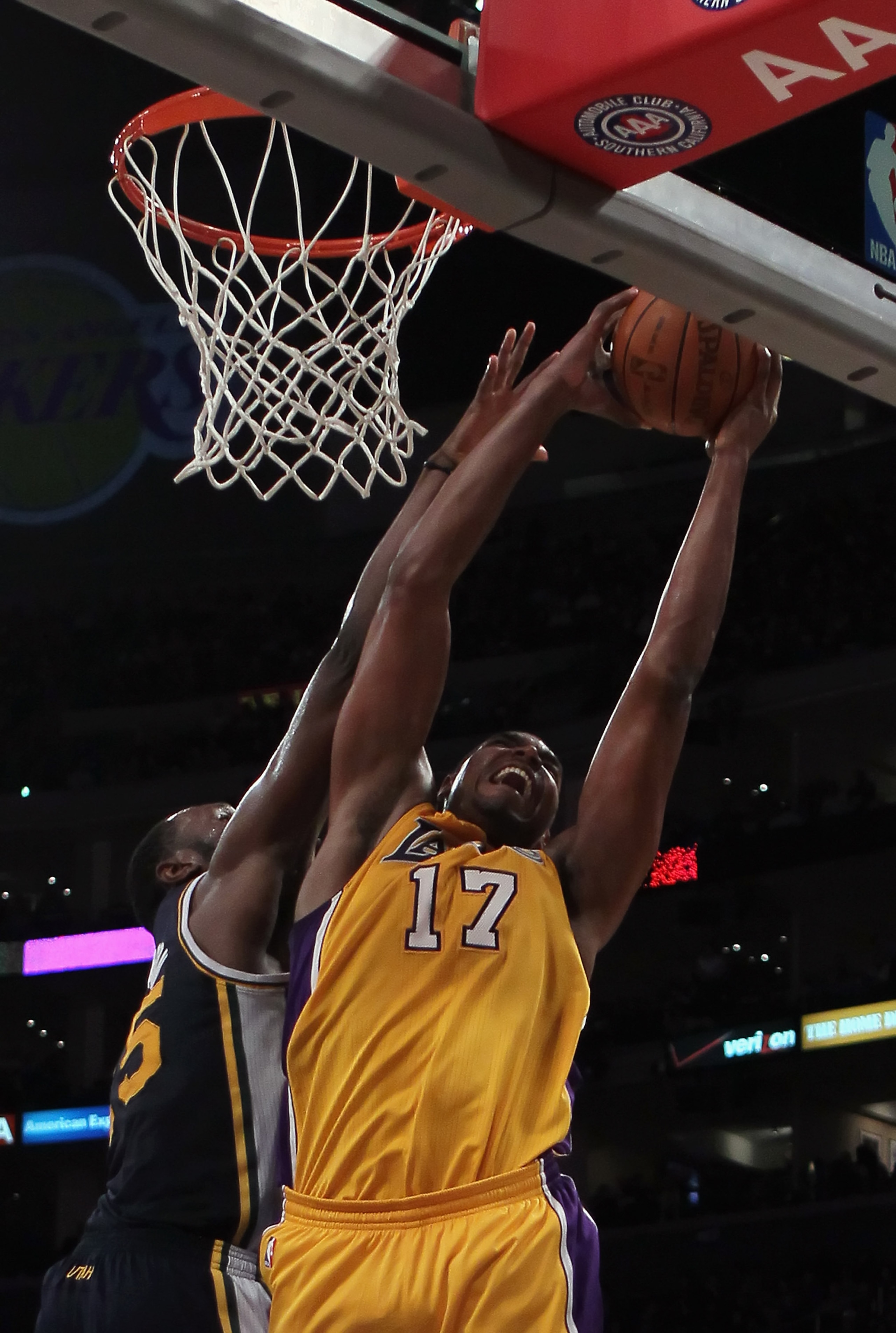 LOS ANGELES, CA - JANUARY 25:  Andrew Bynum #17 of the Los Angeles Lakers drives to the basket while being defended by Al Jefferson #25 of the Utah Jazz in the second half at Staples Center on January 25, 2011 in Los Angeles, California. The Lakers defeat