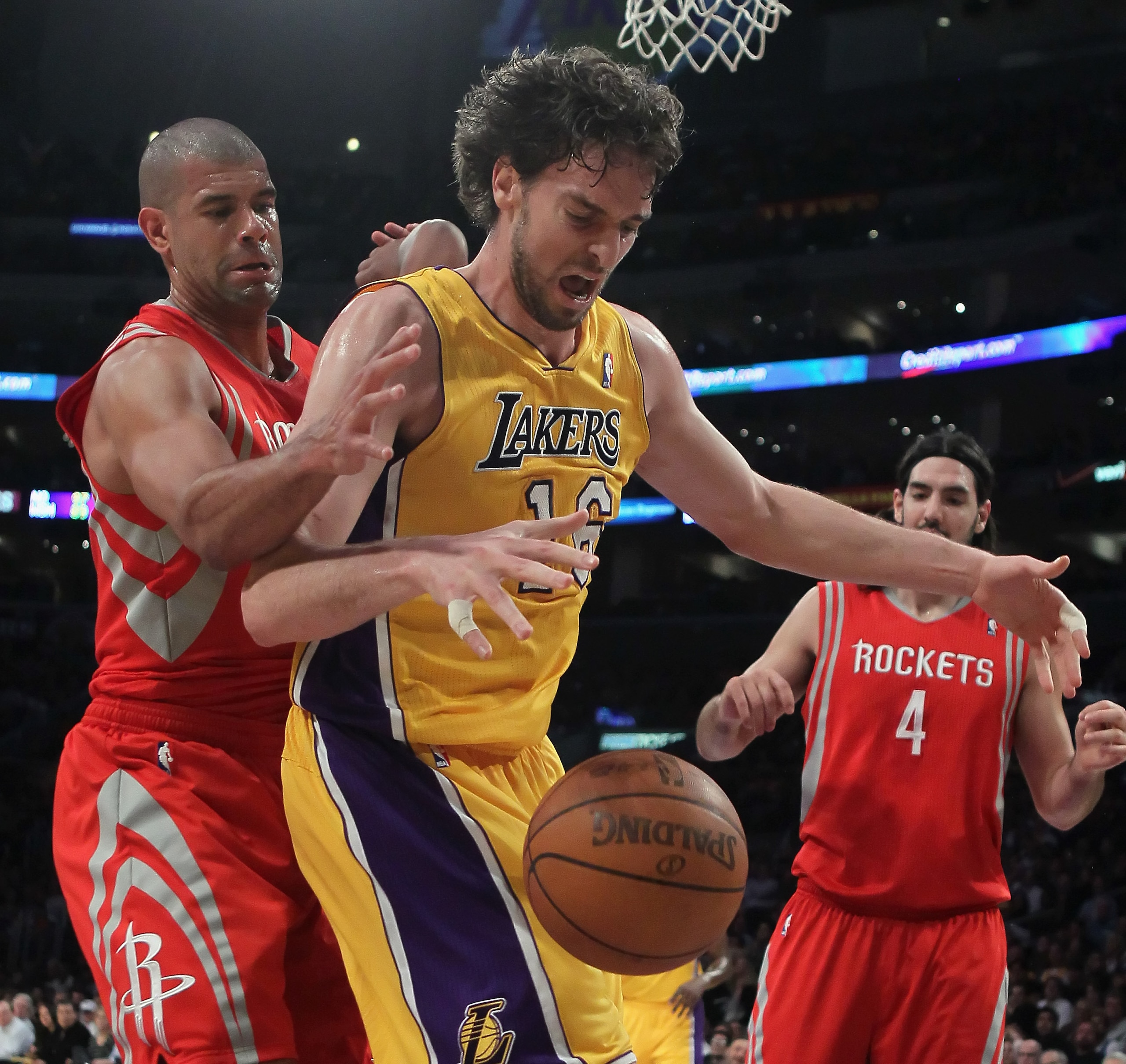LOS ANGELES, CA - FEBRUARY 01:  Pau Gasol #16 of the Los Angeles Lakers and Shane Battier #31 of the Houston Rockets battle for a rebound in the first half at Staples Center on February 1, 2011 in Los Angeles, California. The Lakers defeated the Rockets 1
