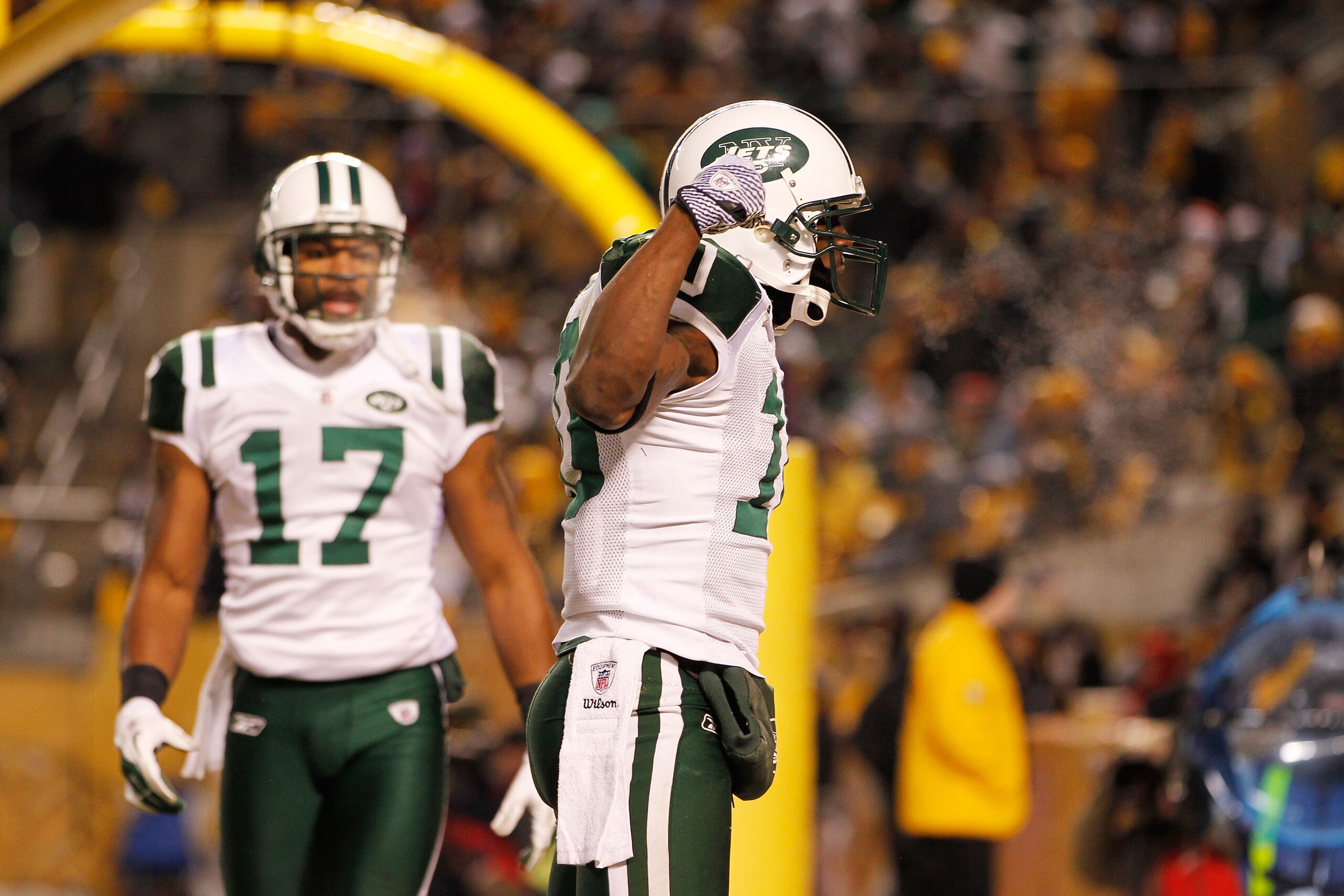 PITTSBURGH, PA - JANUARY 23:  Santonio Holmes #10 and Braylon Edwards #17 of the New York Jets celebrate after Holmes scored a third quarter touchdown against the Pittsburgh Steelers during the 2011 AFC Championship game at Heinz Field on January 23, 2011