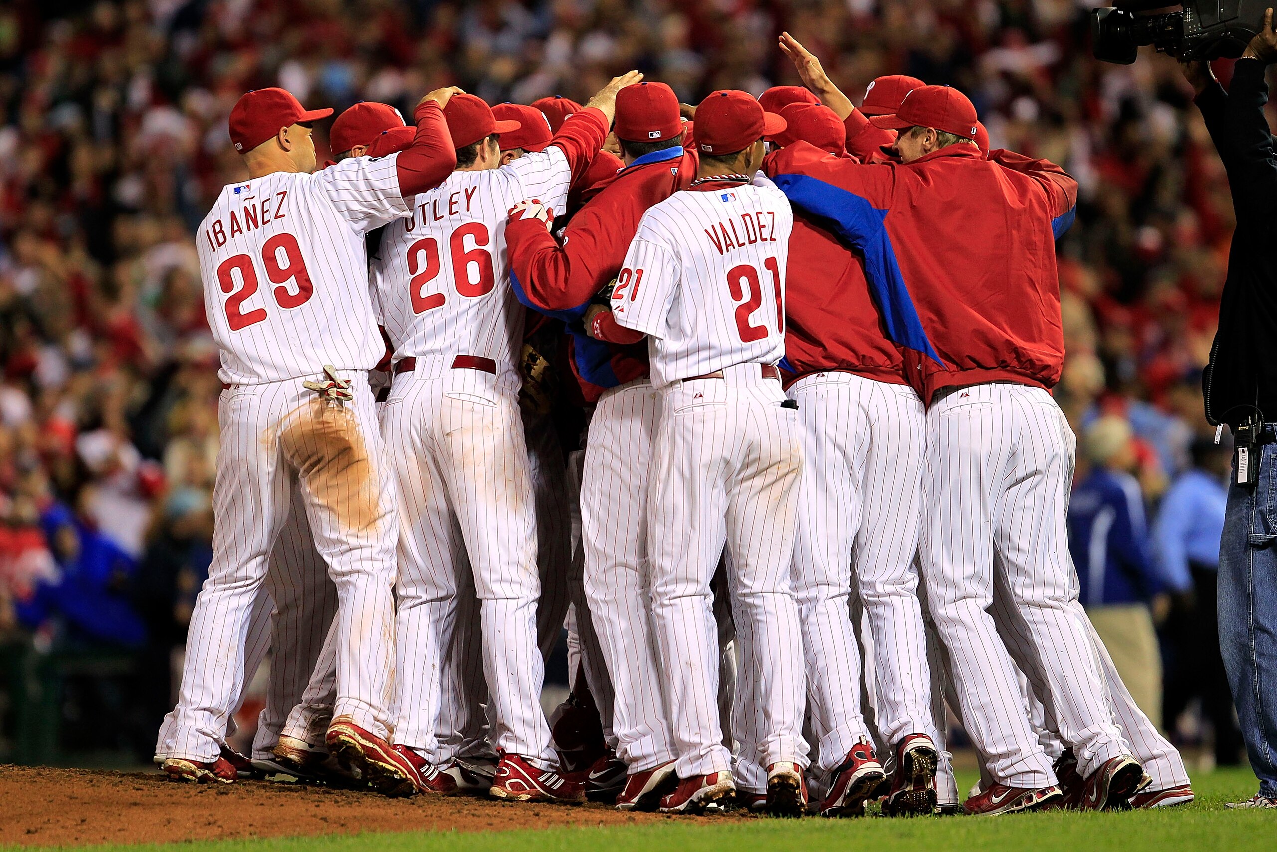 PHILADELPHIA - OCTOBER 06:  Roy Halladay #34 of the Philadelphia Phillies is mobbed by teammates after pitching a no-hitter and the win in Game 1 of the NLDS against the Cincinnati Reds at Citizens Bank Park on October 6, 2010 in Philadelphia, Pennsylvani