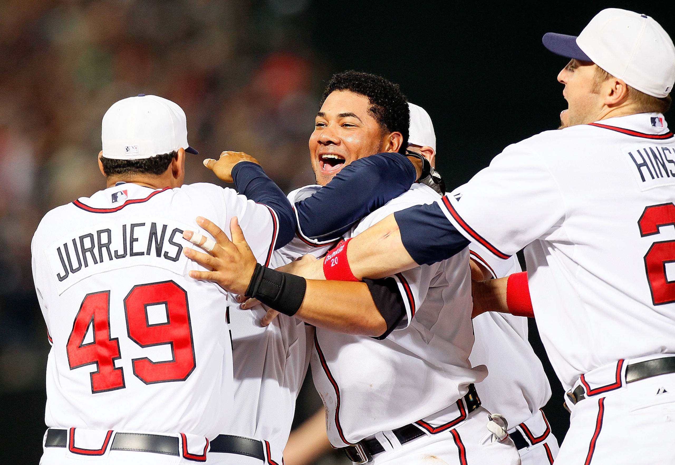 ATLANTA - JULY 02:  Jair Jurrjens #49, Melky Cabrera #53 and Eric Hinske #20 of the Atlanta Braves celebrate with Omar Infante #4 after Infante's two-run single in the 11th inning to give the Braves a 4-3 win over the Florida Marlins at Turner Field on Ju