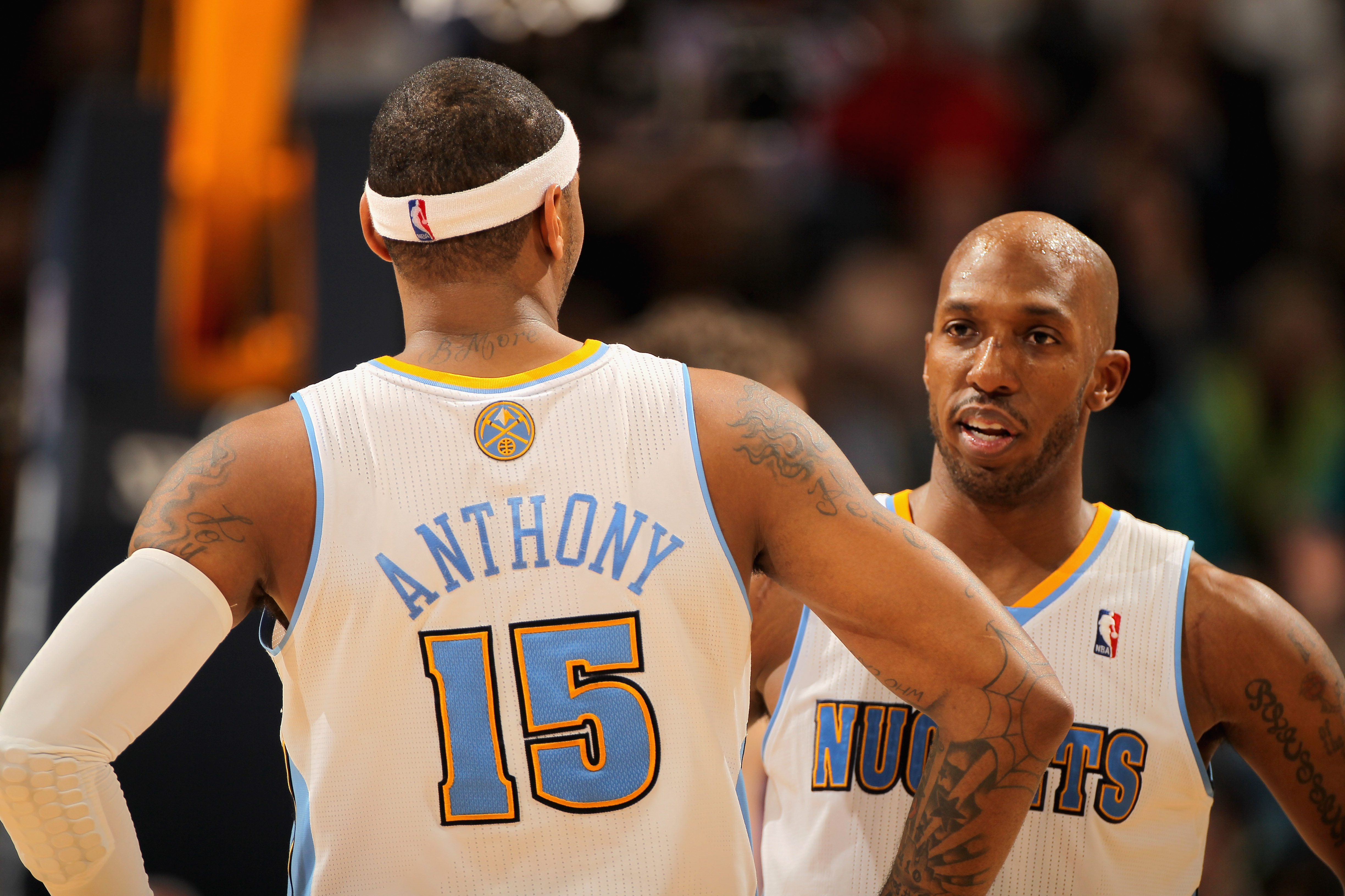 DENVER, CO - JANUARY 21:  Carmelo Anthony #15 and Chauncey Billups #1 of the Denver Nuggets talk during a break in the action against the Los Angeles Lakers at the Pepsi Center on January 21, 2011 in Denver, Colorado. The Lakers defeated the Nuggets 107-9