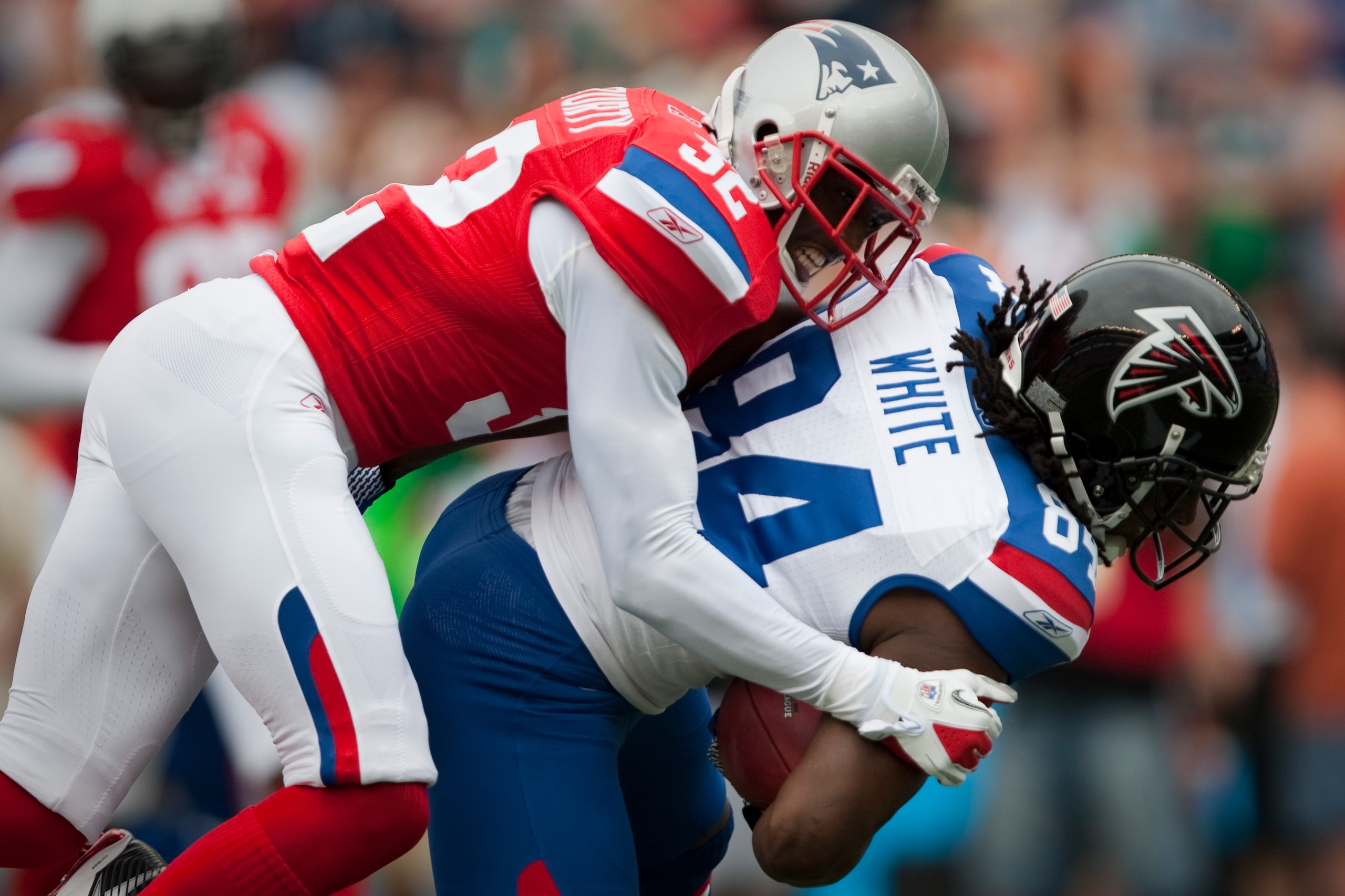HONOLULU - JANUARY 30:  Devin McCourty, #32 of the New England Patriots, tackles Roddy White, #84 of the Atlanta Falcons, during the 2011 NFL Pro Bowl at Aloha Stadium on January 30, 2011 in Honolulu, Hawaii.  (Photo by Kent Nishimura/Getty Images)