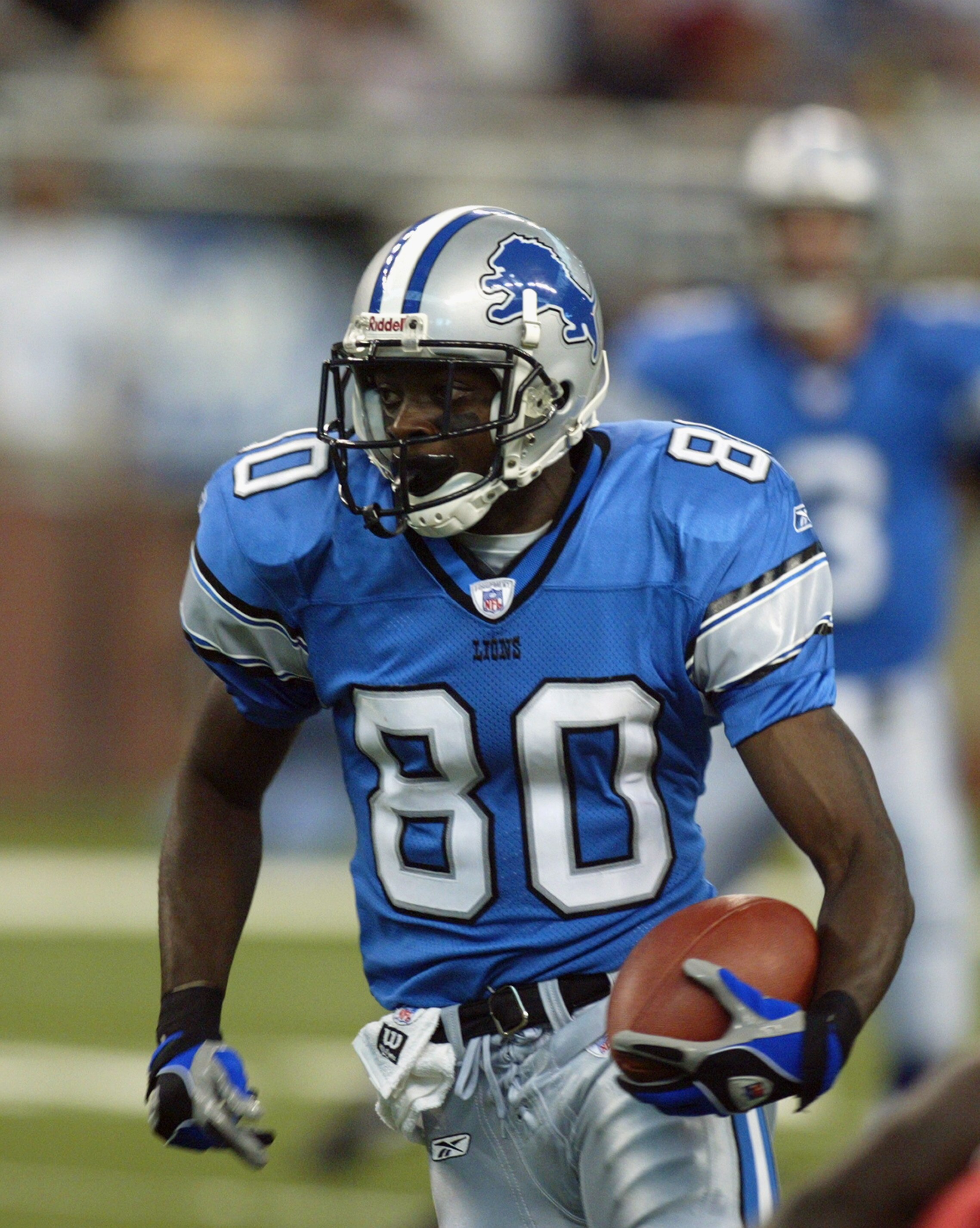 DETROIT, MI - SEPTEMBER 7:  Wide receiver Charles Rogers #80 of the Detroit Lions carries the ball during the NFL game against the Arizona Cardinals at Ford Field on September 7, 2003 in Detroit, Michigan. The Lions defeated the Cardinals 42-24. (Photo by
