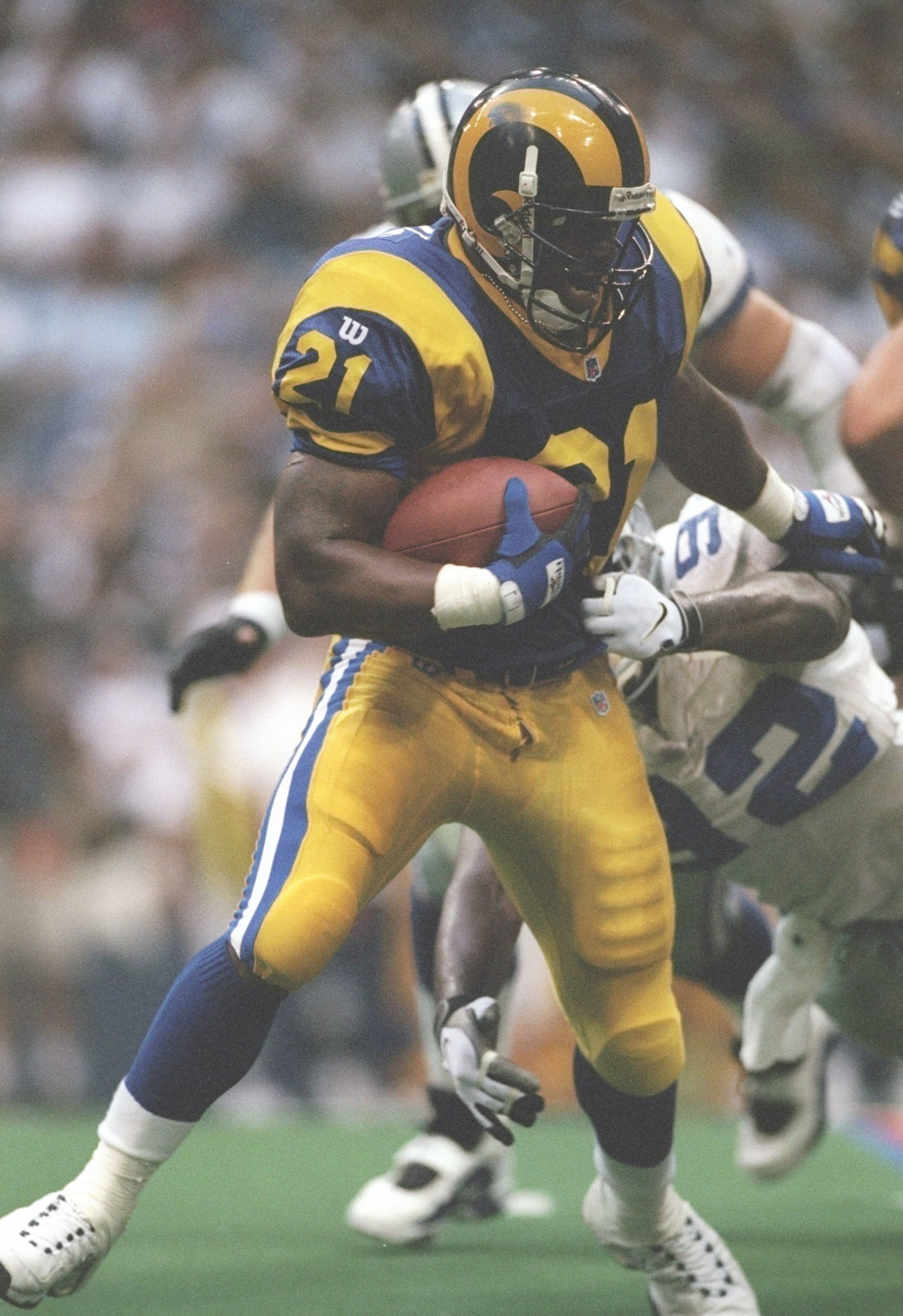 15 Aug 1997: Running back Lawrence Phillips of the St. Louis Rams runs down the field during a game against the Dallas Cowboys at Texas Stadium in Irving, Texas. The Cowboys won the game 34-31.