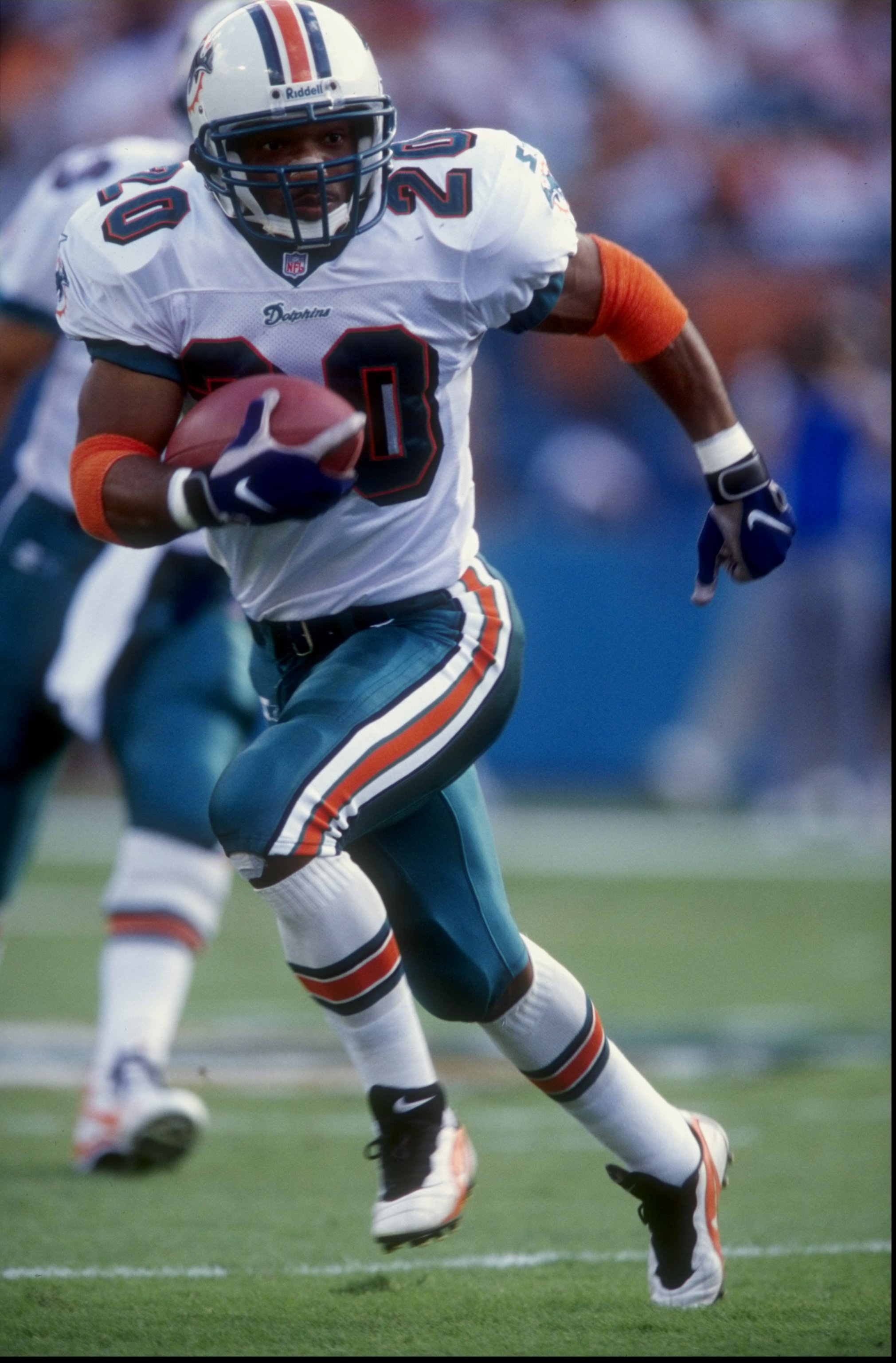 18 Oct 1998:  Runningback John Avery #20 of the Miami Dolphins runs with the ball during a game against the St. Louis Rams at the Pro Player Stadium in Miami, Florida. The Dolphins defeated the Rams 14-0.