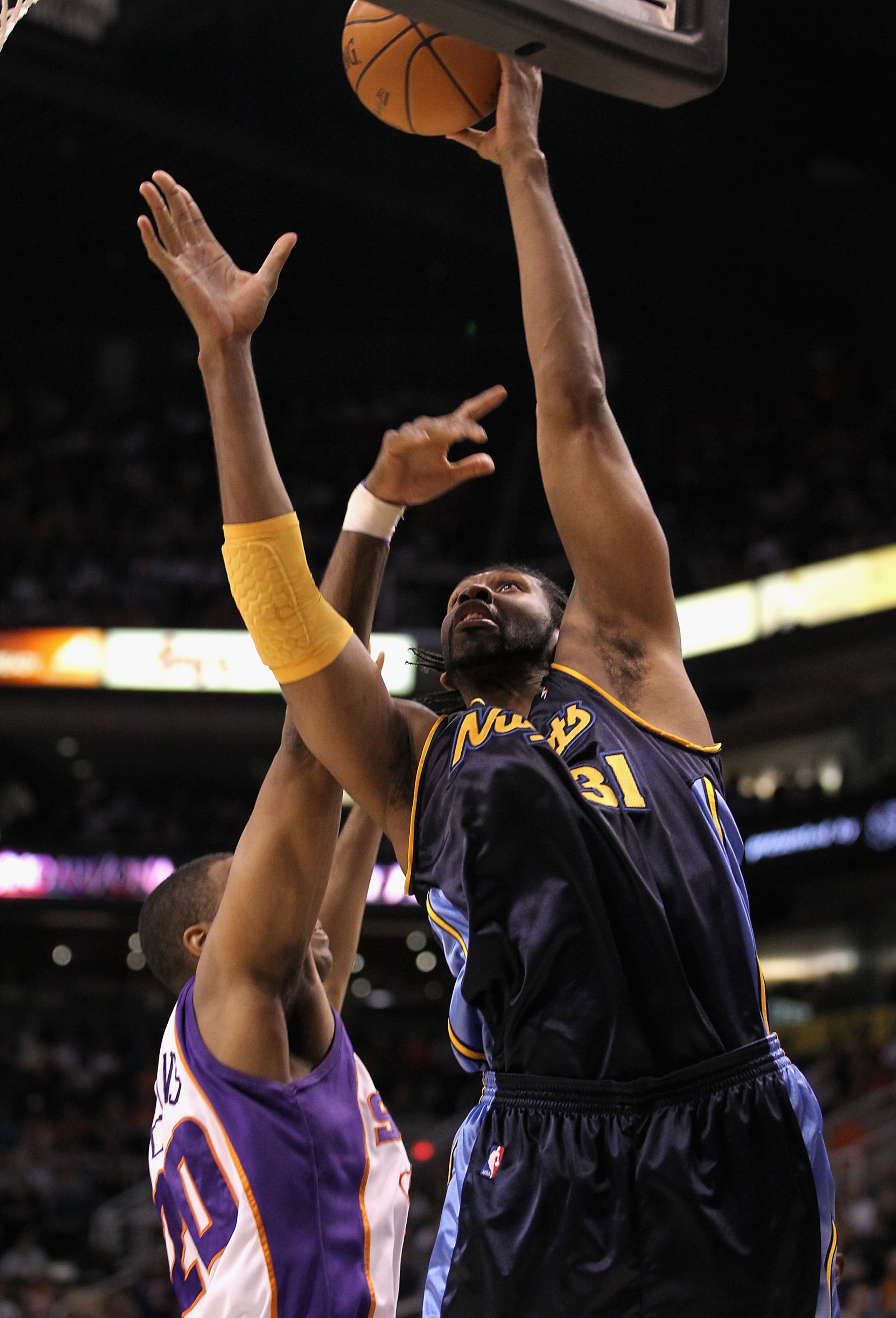 PHOENIX - APRIL 13:  Nenê #31 of the Denver Nuggets puts up a shot during the NBA game against the Phoenix Suns at US Airways Center on April 13, 2010 in Phoenix, Arizona. The Suns defeated the Nuggets 123-101.  NOTE TO USER: User expressly acknowledges a