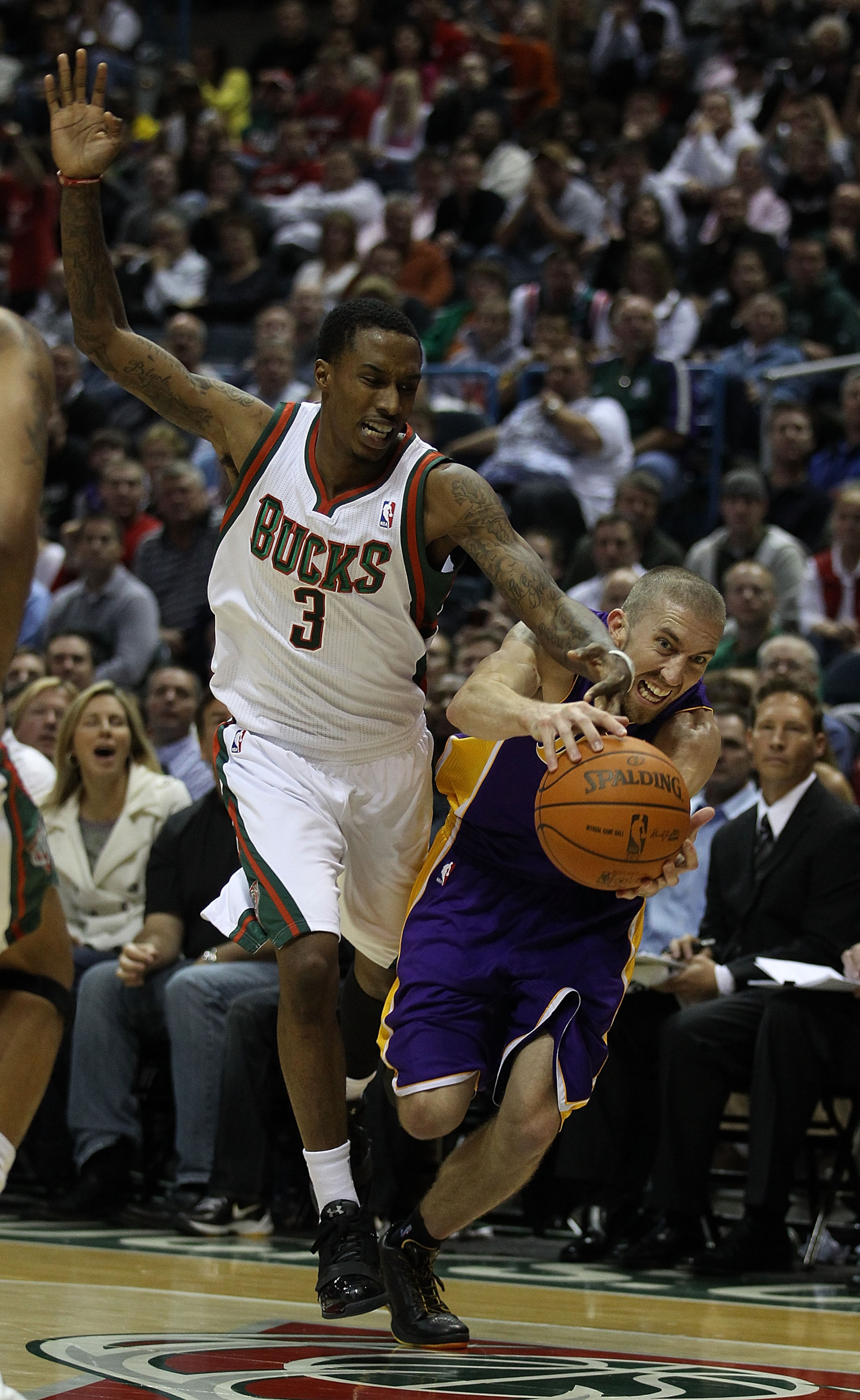 MILWAUKEE - NOVEMBER 16: Brandon Jennings #3 of the Milwaukee Bucks and Steve Blake #5 of the Los Angeles Lakers battle for a loose ball at the Bradley Center on November 16, 2010 in Milwaukee, Wisconsin. The Lakers defeated the Bucks 118-107. NOTE TO USE MILWAUKEE - NOVEMBER 16: Brandon Jennings #3 of the Milwaukee Bucks and Steve Blake #5 of the Los Angeles Lakers battle for a loose ball at the Bradley Center on November 16, 2010 in Milwaukee, Wisconsin. The Lakers defeated the Bucks 118-107. NOTE TO USE