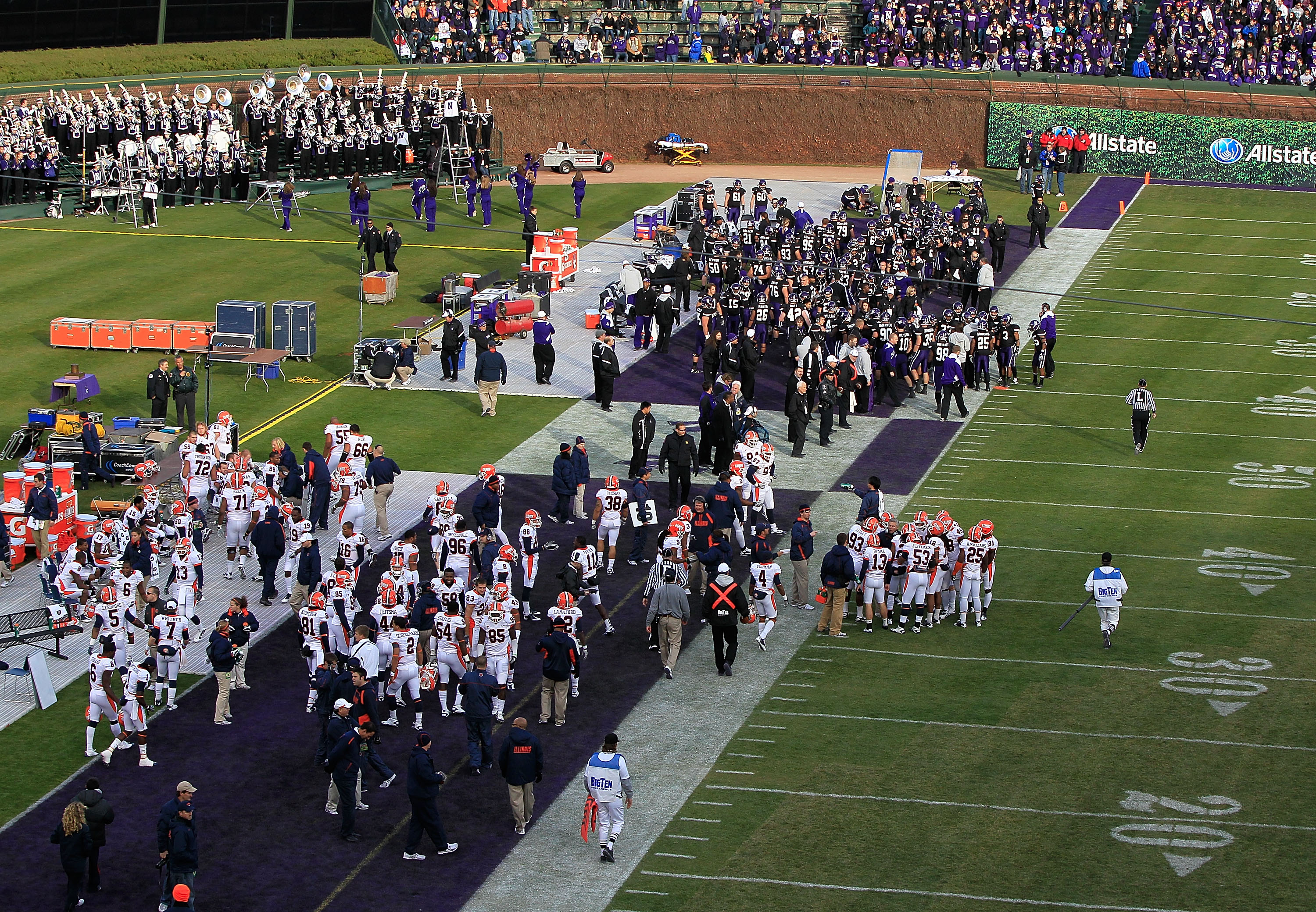 CHICAGO - NOVEMBER 20: Teams from the Northwestern Wildcats (top) and the Illinois Fighting Illini share a sideline during a game played at Wrigley Field on November 20, 2010 in Chicago, Illinois. (Photo by Jonathan Daniel/Getty Images)