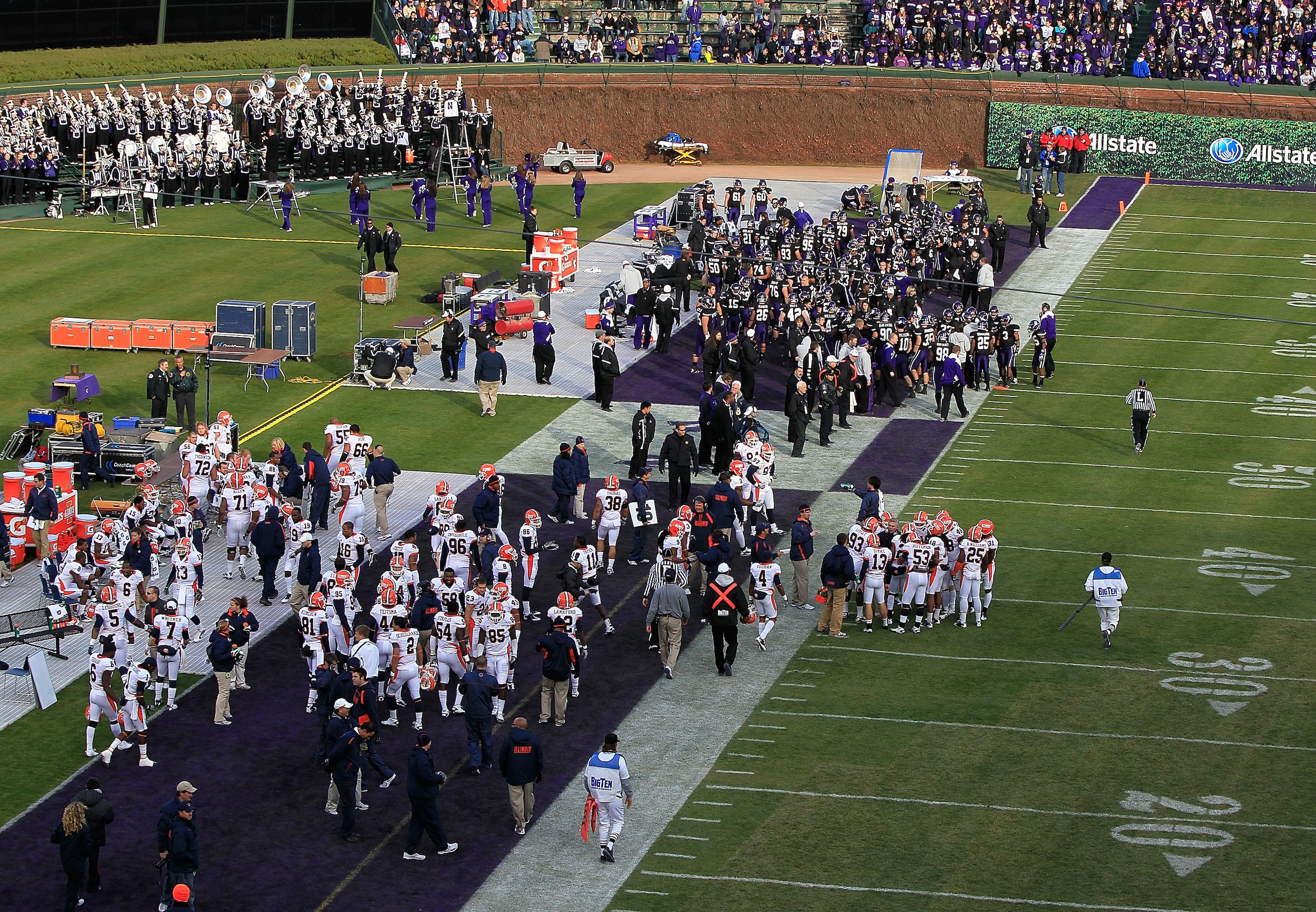CHICAGO - NOVEMBER 20: Teams from the Northwestern Wildcats (top) and the Illinois Fighting Illini share a sideline during a game played at Wrigley Field on November 20, 2010 in Chicago, Illinois. (Photo by Jonathan Daniel/Getty Images) CHICAGO - NOVEMBER 20: Teams from the Northwestern Wildcats (top) and the Illinois Fighting Illini share a sideline during a game played at Wrigley Field on November 20, 2010 in Chicago, Illinois. (Photo by Jonathan Daniel/Getty Images)
