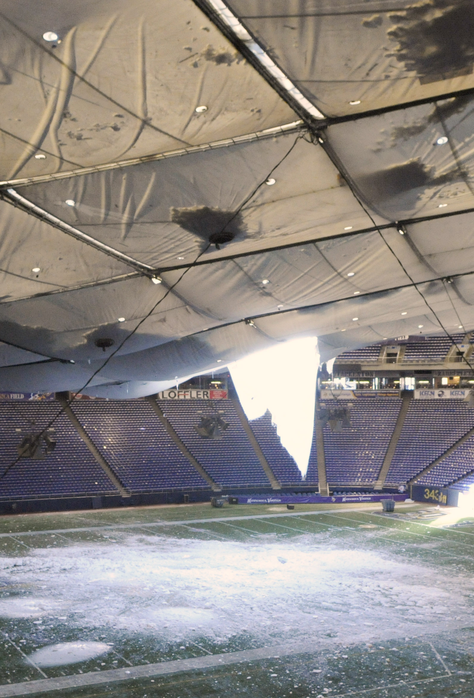 MINNEAPOLIS, MN - DECEMBER 13: A torn section of the roof sags inside the Hubert H. Humphrey Metrodome on December 13, 2010 in Minneapolis, Minnesota. The Metrodome's roof collapsed under the weight of snow after a powerful blizzard hit the area on Decemb