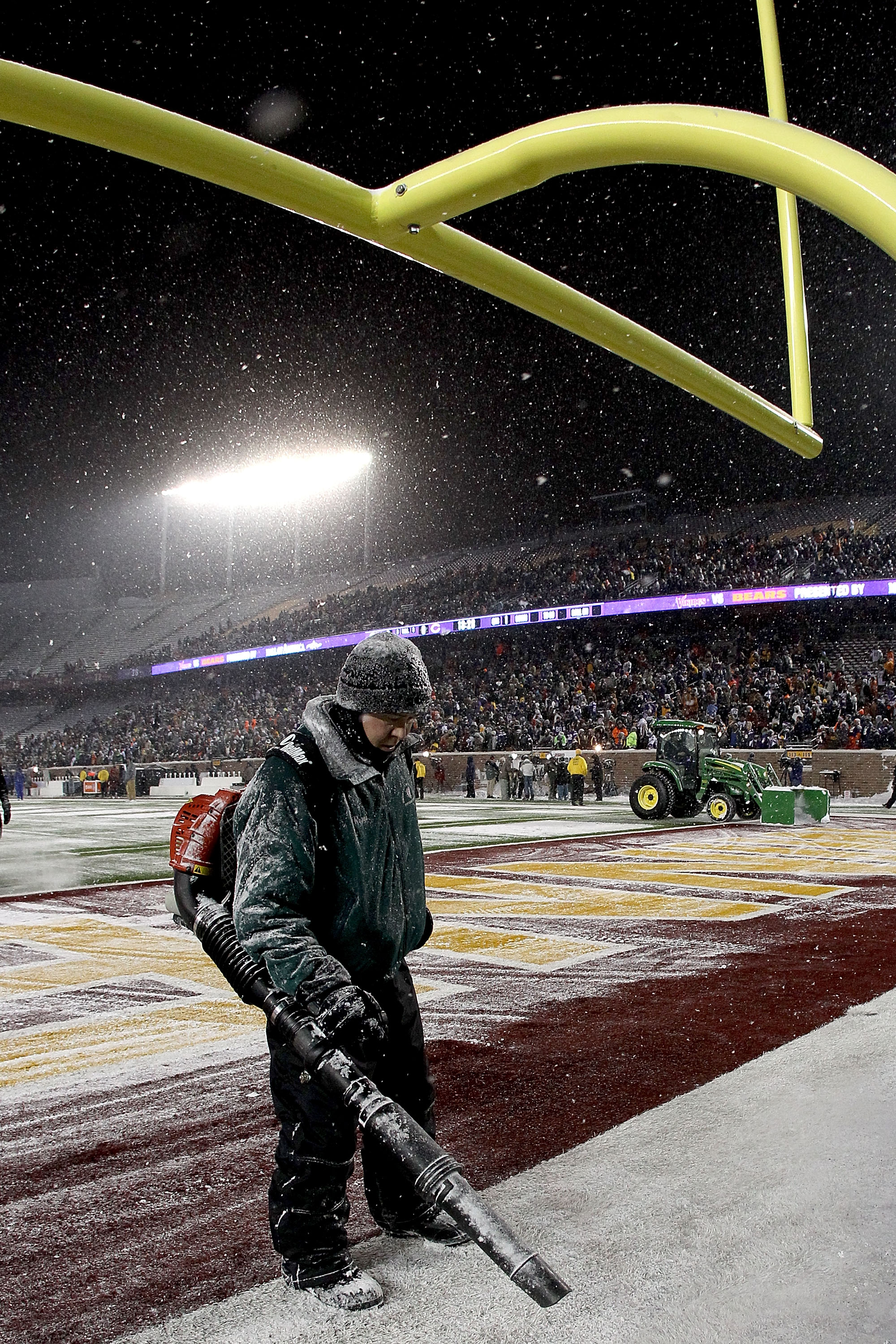MINNEAPOLIS, MN - DECEMBER 20:  Workers clear snow from the field before Minnesota Vikings play the Chicago Bears at TCF Bank Stadium on December 20, 2010 in Minneapolis, Minnesota.  (Photo by Matthew Stockman/Getty Images)