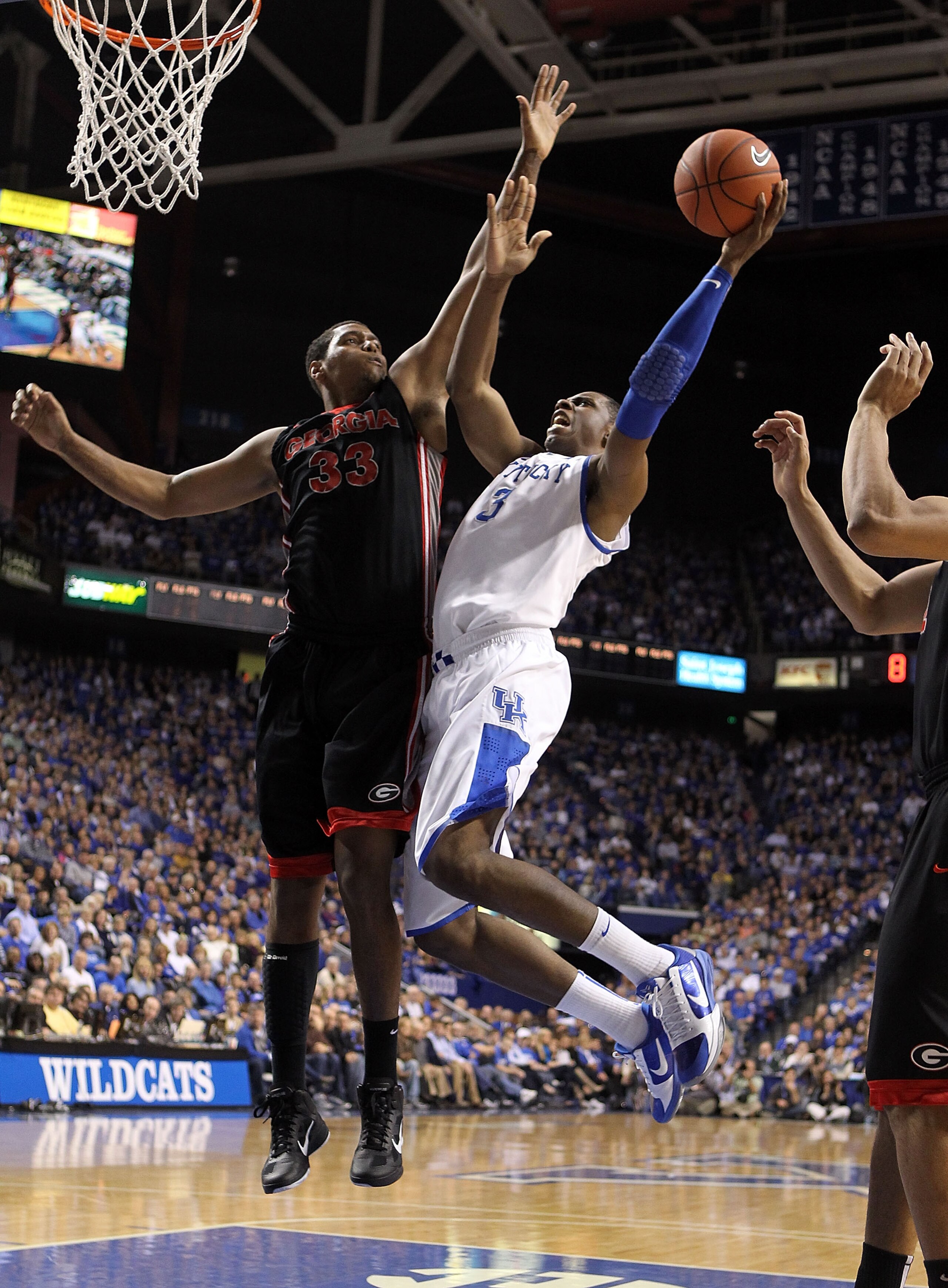 LEXINGTON, KY - JANUARY 29:  Terrence Jones #3 of the Kentucky Wildcats shoots the ball while defended by Trey Thompkins #33 of the Georgia Bulldogs during the SEC game at Rupp Arena on January 29, 2011 in Lexington, Kentucky. Kentucky won 66-60.  (Photo
