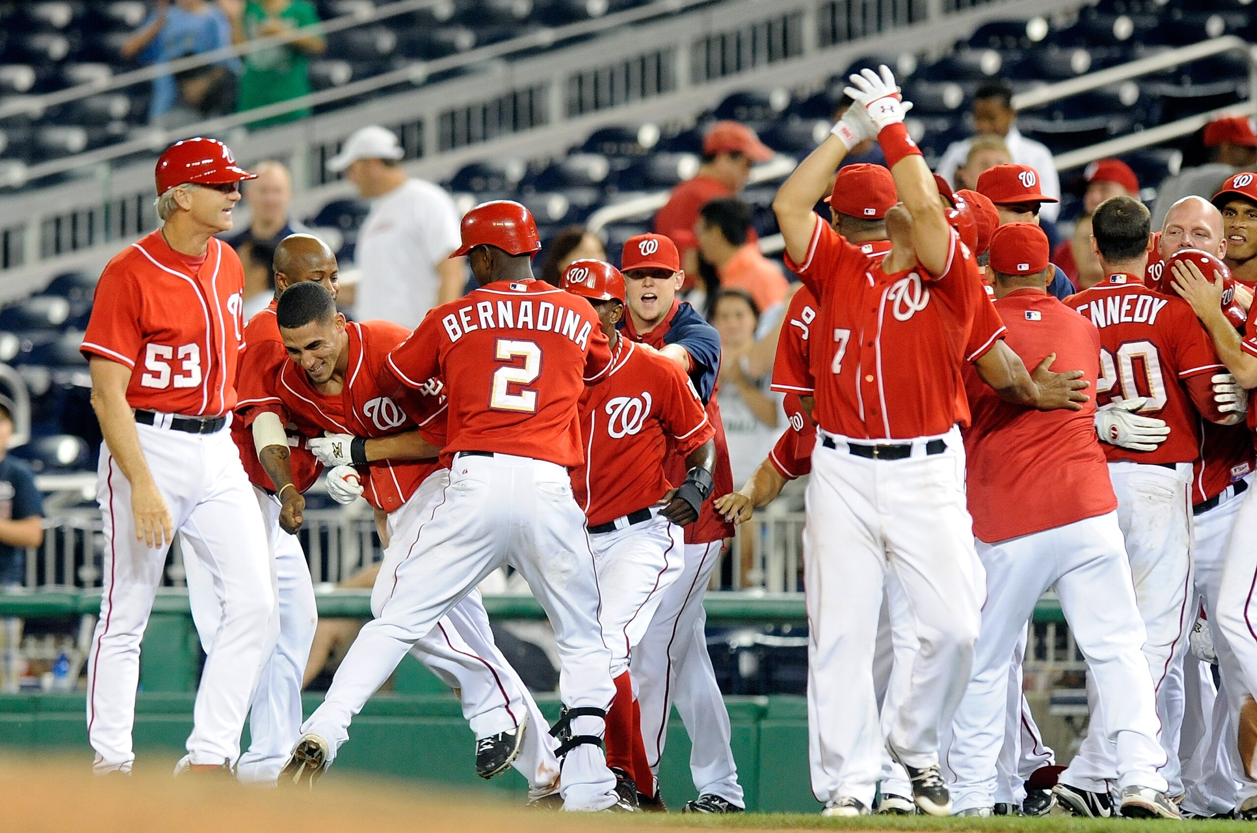 WASHINGTON - AUGUST 26:  Ian Desmond #6 of the Washington Nationals is mobbed by teammates after driving in the game winning run in the thirteenth inning against the St. Louis Cardinals at Nationals Park on August 26, 2010 in Washington, DC.  The National