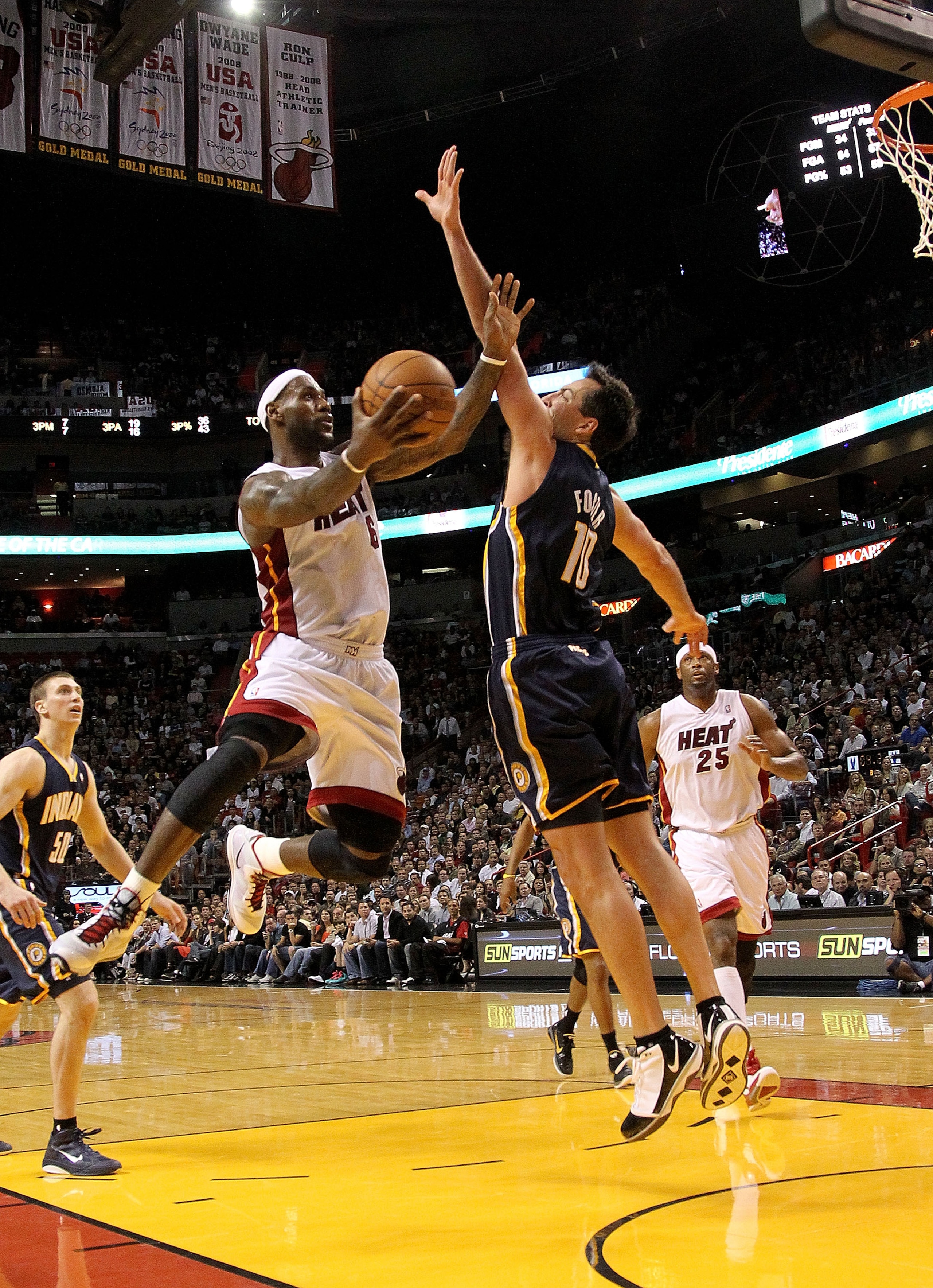 MIAMI, FL - FEBRUARY 08:  LeBron James #6 of the Miami Heat shoots over Jeff Foster #10 of the Indiana Pacers during a game at American Airlines Arena on February 8, 2011 in Miami, Florida. NOTE TO USER: User expressly acknowledges and agrees that, by dow