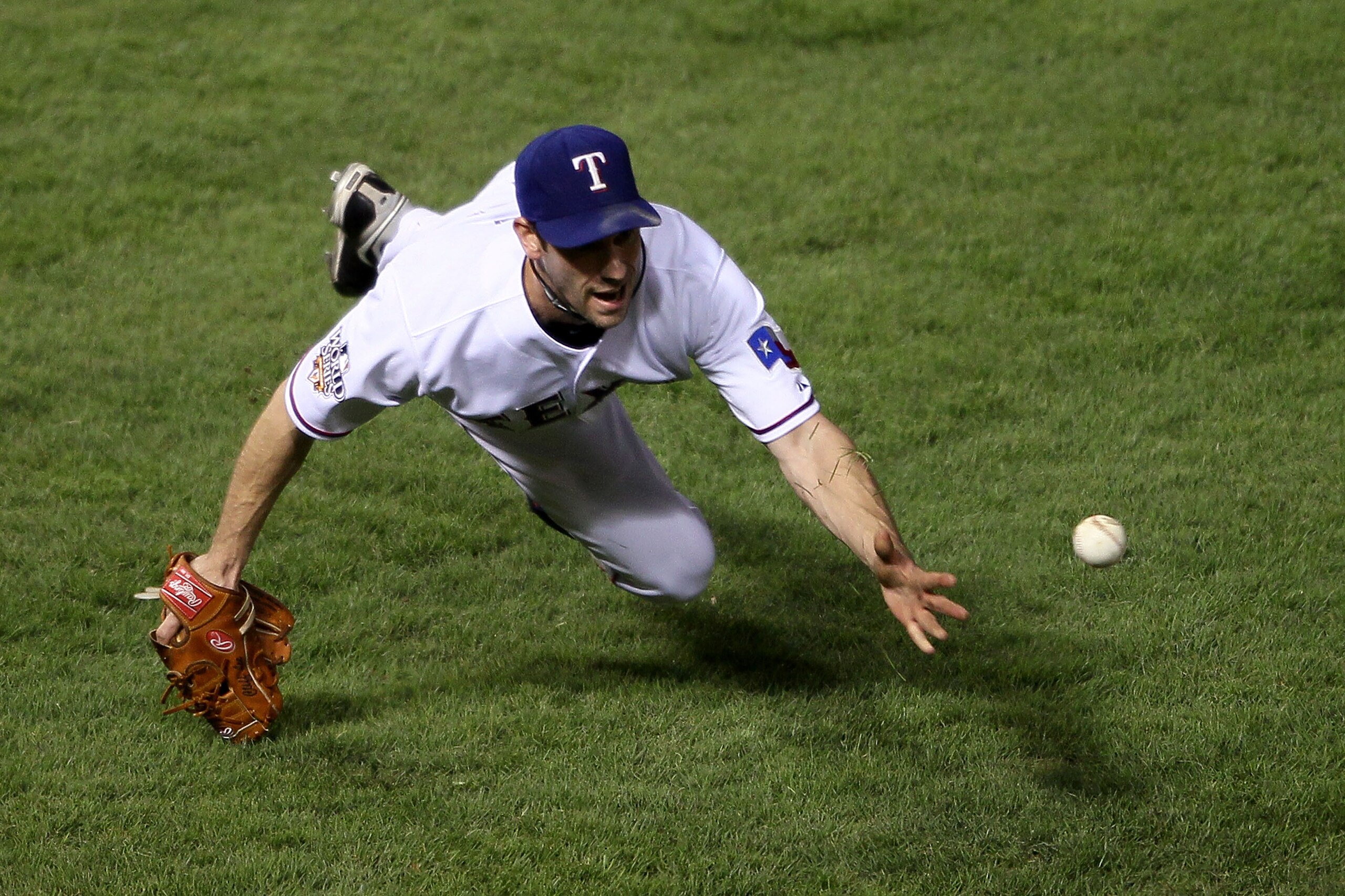 ARLINGTON, TX - NOVEMBER 01: Cliff Lee #33 of the Texas Rangers tosses over to first for the out after a sac bunt by Aubrey Huff of the San Francisco Giants in Game Five of the 2010 MLB World Series at Rangers Ballpark in Arlington on November 1, 2010 in ARLINGTON, TX - NOVEMBER 01: Cliff Lee #33 of the Texas Rangers tosses over to first for the out after a sac bunt by Aubrey Huff of the San Francisco Giants in Game Five of the 2010 MLB World Series at Rangers Ballpark in Arlington on November 1, 2010 in