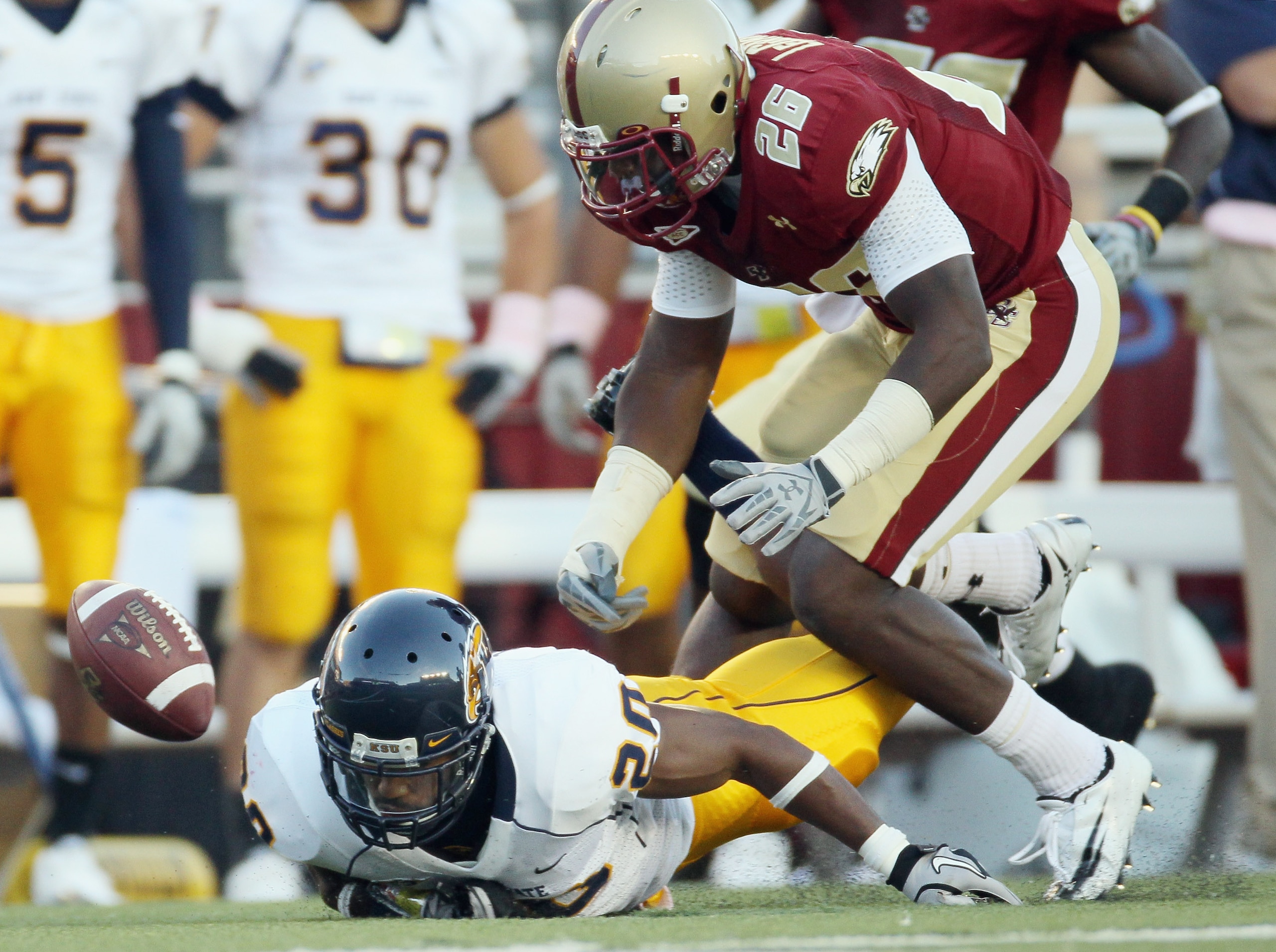 CHESTNUT HILL, MA - SEPTEMBER 11: Dominick LeGrande #26 of the Boston College Eagles and Will Johnson #20 of the Kent State Golden Flashes chase after the fumble on September 11, 2010 at Alumni Stadium in Chestnut Hill, Massachusetts. Boston College defea CHESTNUT HILL, MA - SEPTEMBER 11: Dominick LeGrande #26 of the Boston College Eagles and Will Johnson #20 of the Kent State Golden Flashes chase after the fumble on September 11, 2010 at Alumni Stadium in Chestnut Hill, Massachusetts. Boston College defea