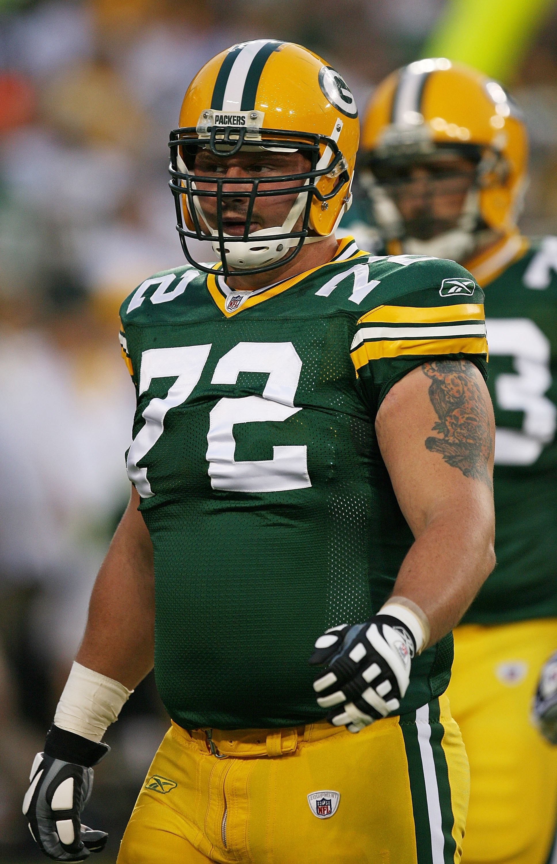 Green Bay Packers Jason Spitz (72) and teammates react to a hard