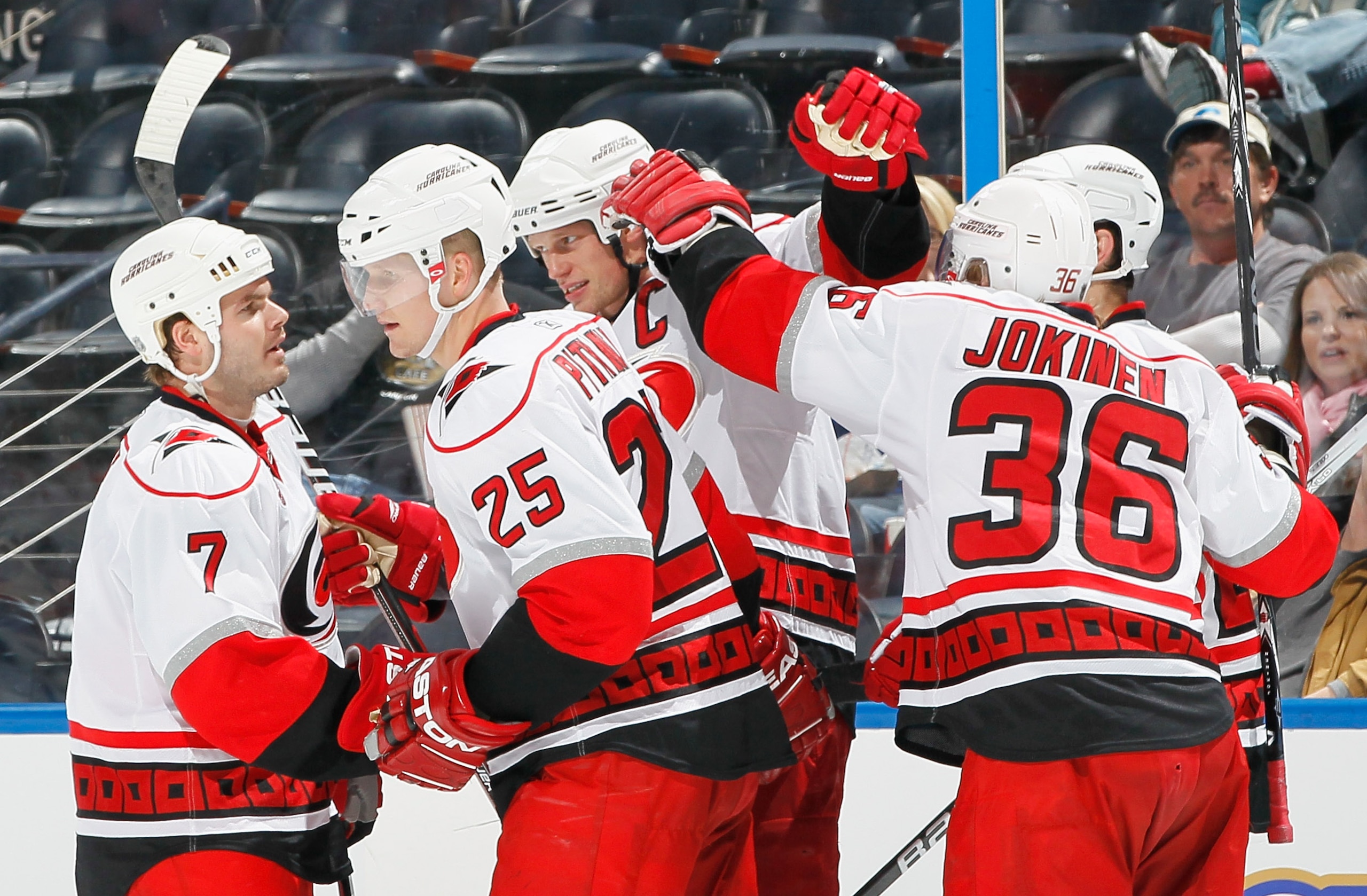 ATLANTA, GA - DECEMBER 16:  Eric Staal #12 of the Carolina Hurricanes celebrates his goal against the Atlanta Thrashers with Ian White #7, Joni Pitkanen #25 and Jussi Jokinen #36 at Philips Arena on December 16, 2010 in Atlanta, Georgia.  (Photo by Kevin