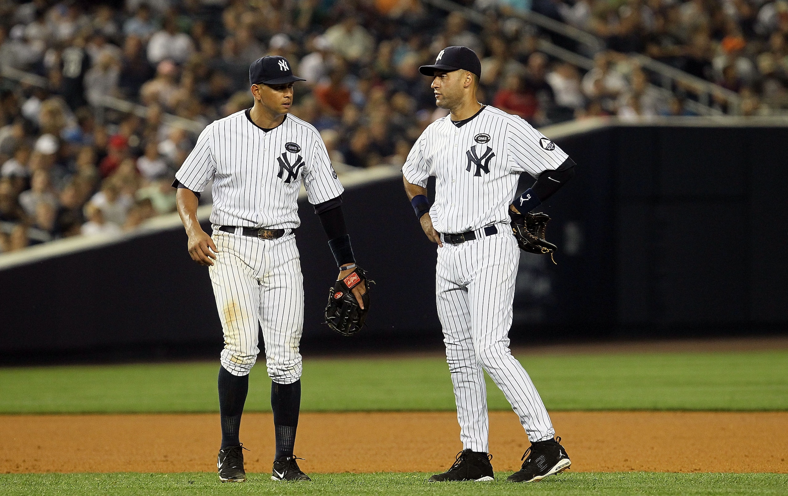 NEW YORK - JULY 16: Derek Jeter #2 (R) and Alex Rodriguez #13 of the New York Yankees look on against the Tampa Bay Rays on July 16, 2010 at Yankee Stadium in the Bronx borough of New York City. (Photo by Jim McIsaac/Getty Images) NEW YORK - JULY 16: Derek Jeter #2 (R) and Alex Rodriguez #13 of the New York Yankees look on against the Tampa Bay Rays on July 16, 2010 at Yankee Stadium in the Bronx borough of New York City. (Photo by Jim McIsaac/Getty Images)