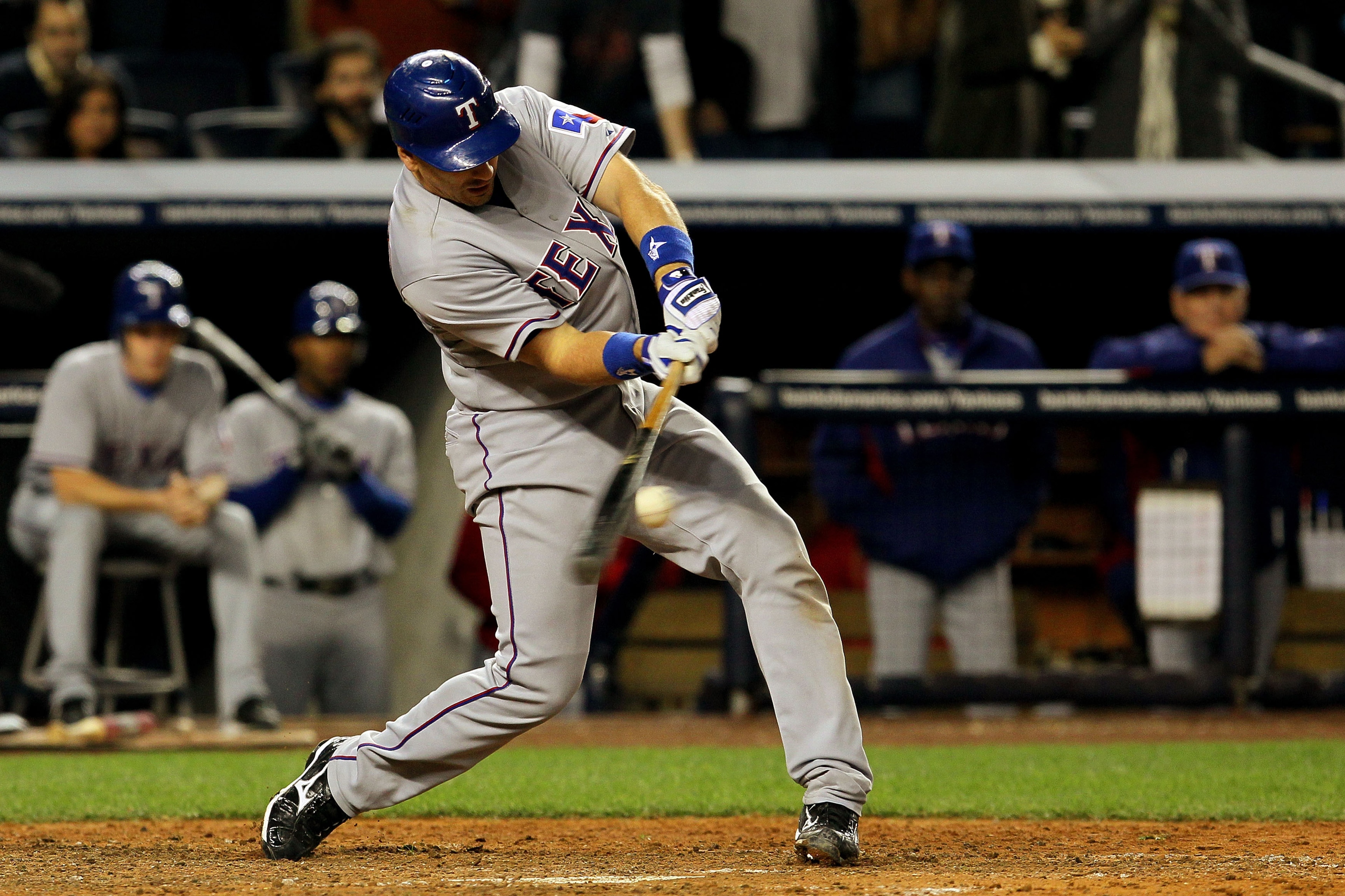 NEW YORK - OCTOBER 20:  Matt Treanor #15 of the Texas Rangers hits a RBI ground out in the top of the sixth inning against the New York Yankees  in Game Five of the ALCS during the 2010 MLB Playoffs at Yankee Stadium on October 20, 2010 in the Bronx borou