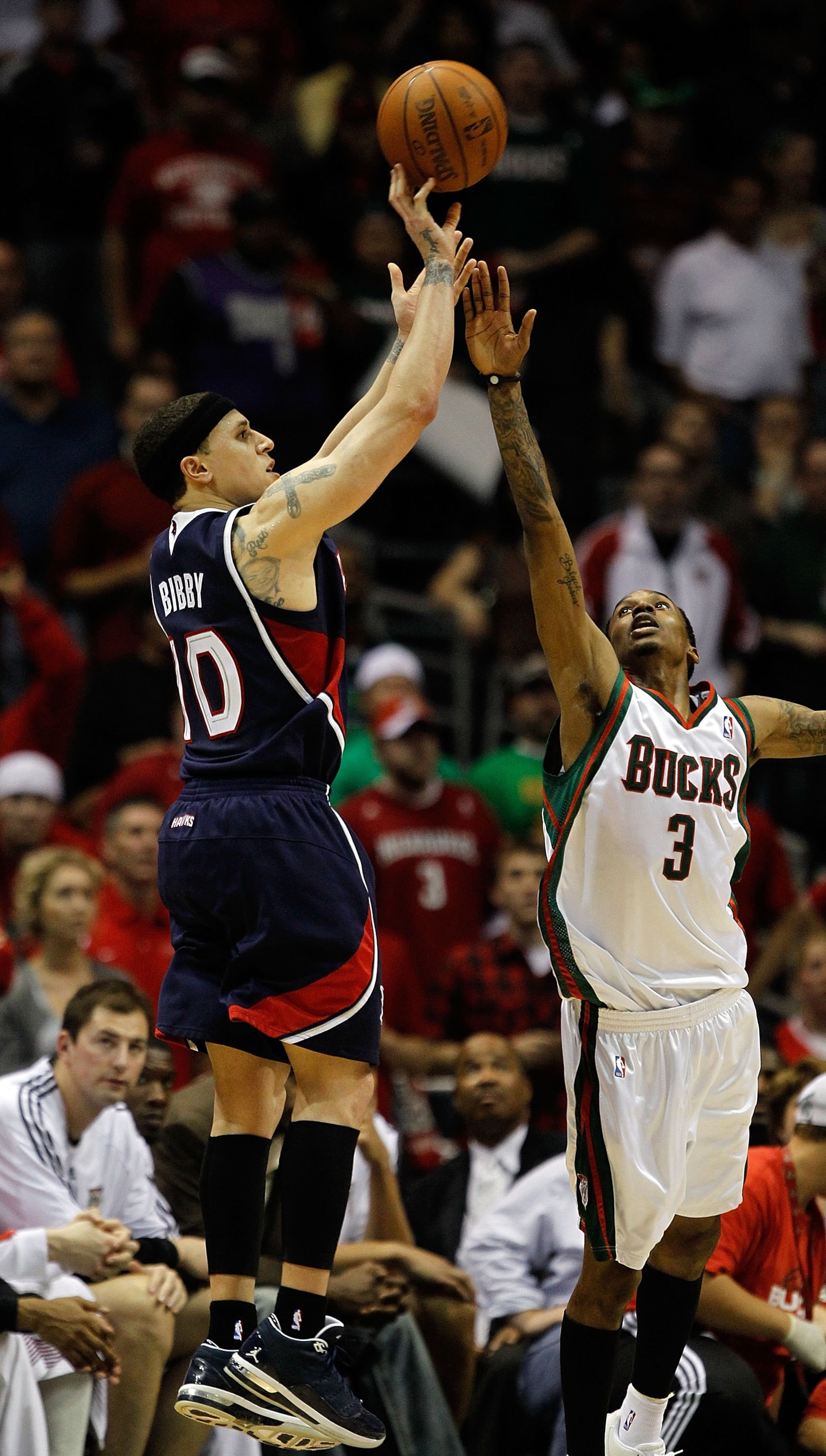 MILWAUKEE - APRIL 30: Mike Bibby #10 of the Atlanta Hawks puts up a shot over Brandon Jennings #3 of the Milwaukee Bucks in Game Six of the Eastern Conference Quarterfinals during the 2010 NBA Playoffs at the Bradley Center on April 30, 2010 in Milwaukee,