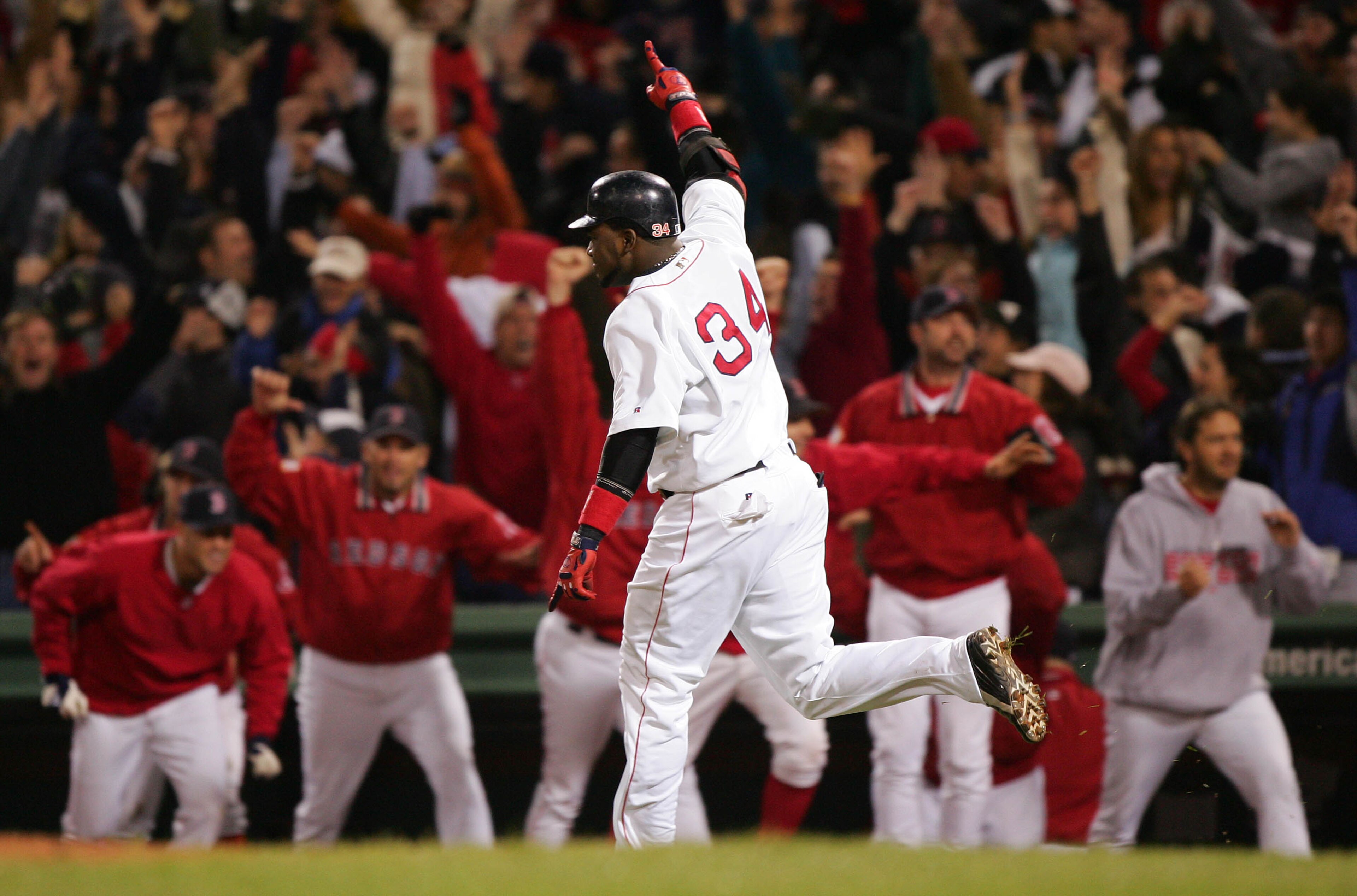 BOSTON - OCTOBER 17:  David Ortiz #34 celebrates after hitting the game winning two-run home run against the New York Yankees in the twelfth inning during game four of the American League Championship Series on October 17, 2004 at Fenway Park in Boston, M