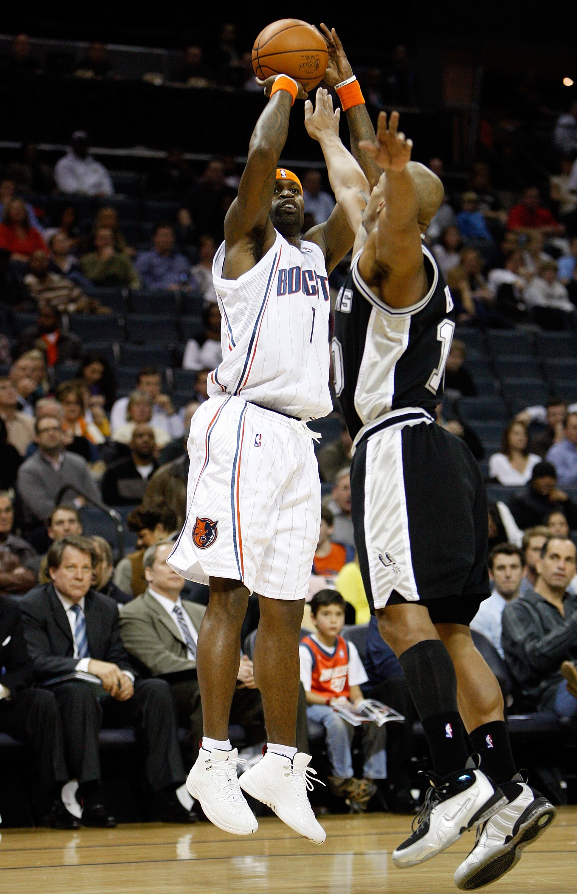 CHARLOTTE, NC - JANUARY 15:  Stephen Jackson #1 of the Charlotte Bobcats shoots over Keith Bogans #10 of the San Antonio Spurs during the game on January 15, 2010 at Time Warner Cable Arena in Charlotte, North Carolina.  The Bobcats won 92-76.  NOTE TO US