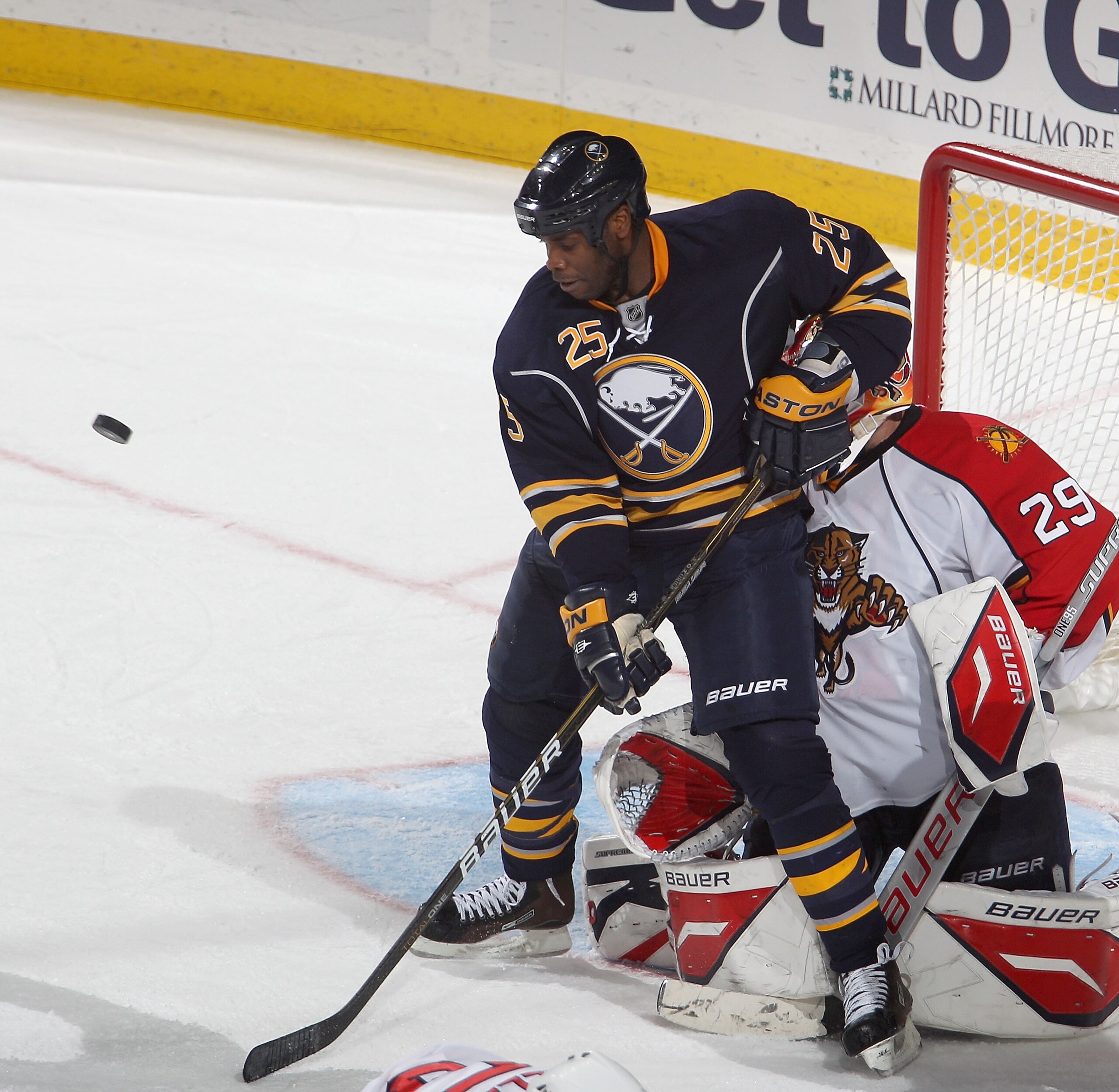 BUFFALO, NY - DECEMBER 23: Mike Grier #25 of the Buffalo Sabres tries to make a play against Tomas Vokoun #29 of the Florida Panthers at HSBC Arena on December 23, 2010 in Buffalo, New York. Florida won 4-3.  (Photo by Rick Stewart/Getty Images)