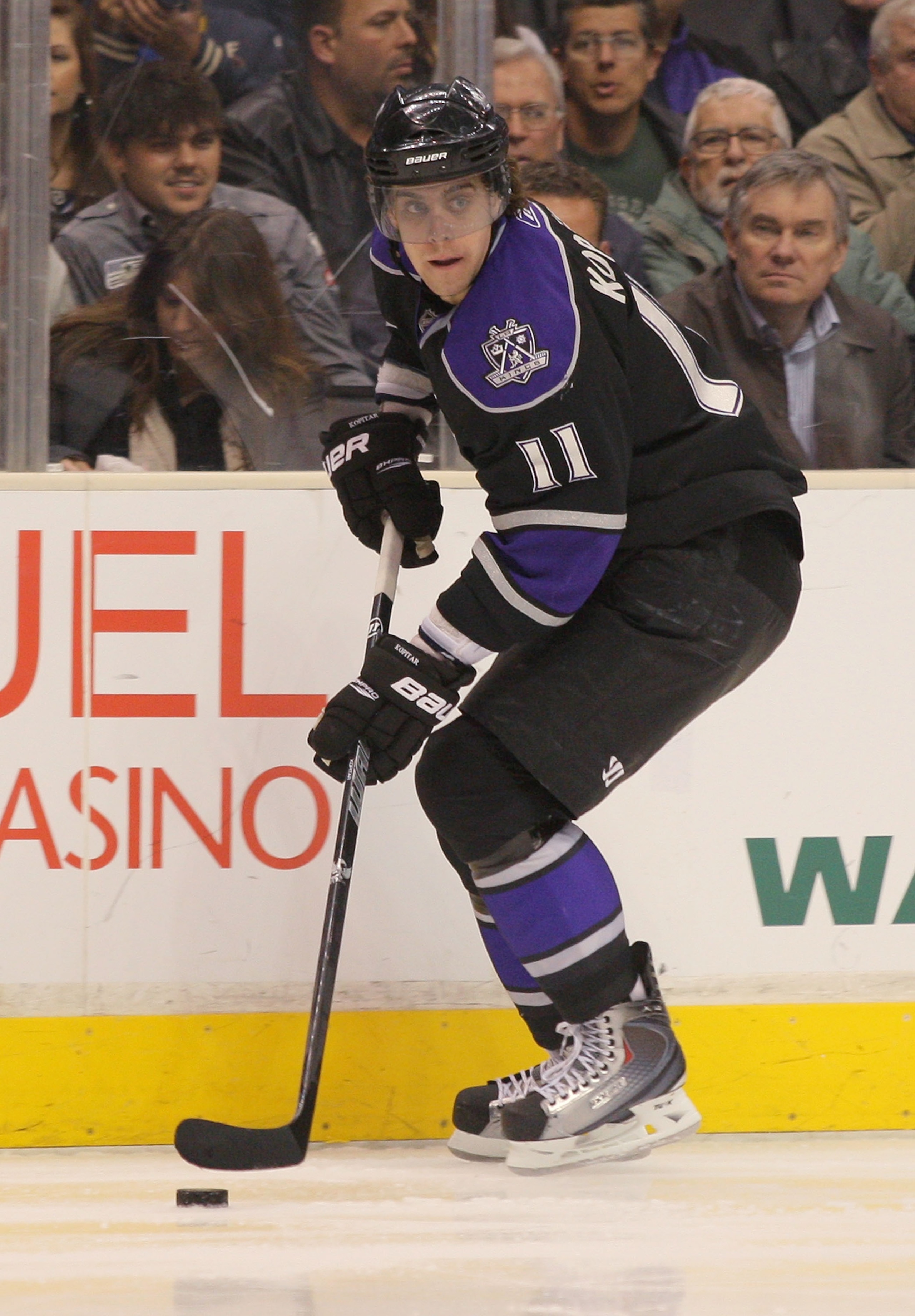 LOS ANGELES, CA - JANUARY 26:  Anze Kopitar #11 of the Los Angeles Kings controls the puck against the San Jose Sharks at Staples Center on January 26, 2011 in Los Angeles, California.  (Photo by Victor Decolongon/Getty Images)