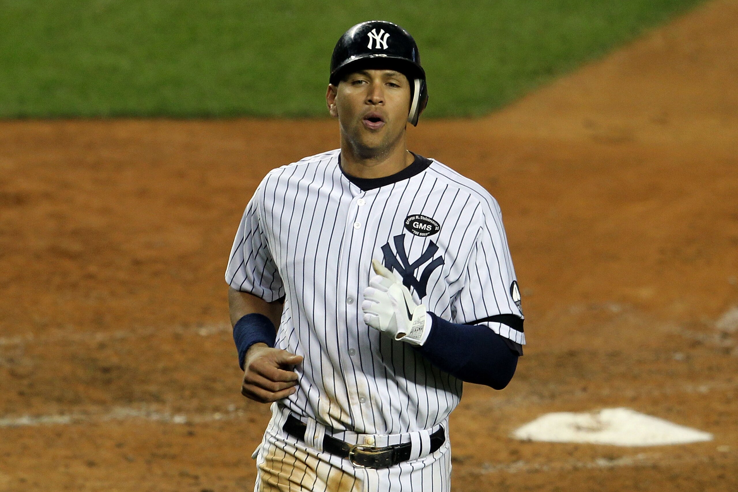 NEW YORK - OCTOBER 19:  Alex Rodriguez #13 of the New York Yankees reacts after he score in the bottom of the fourth inning against the Texas Rangers in Game Four of the ALCS during the 2010 MLB Playoffs at Yankee Stadium on October 19, 2010 in the Bronx