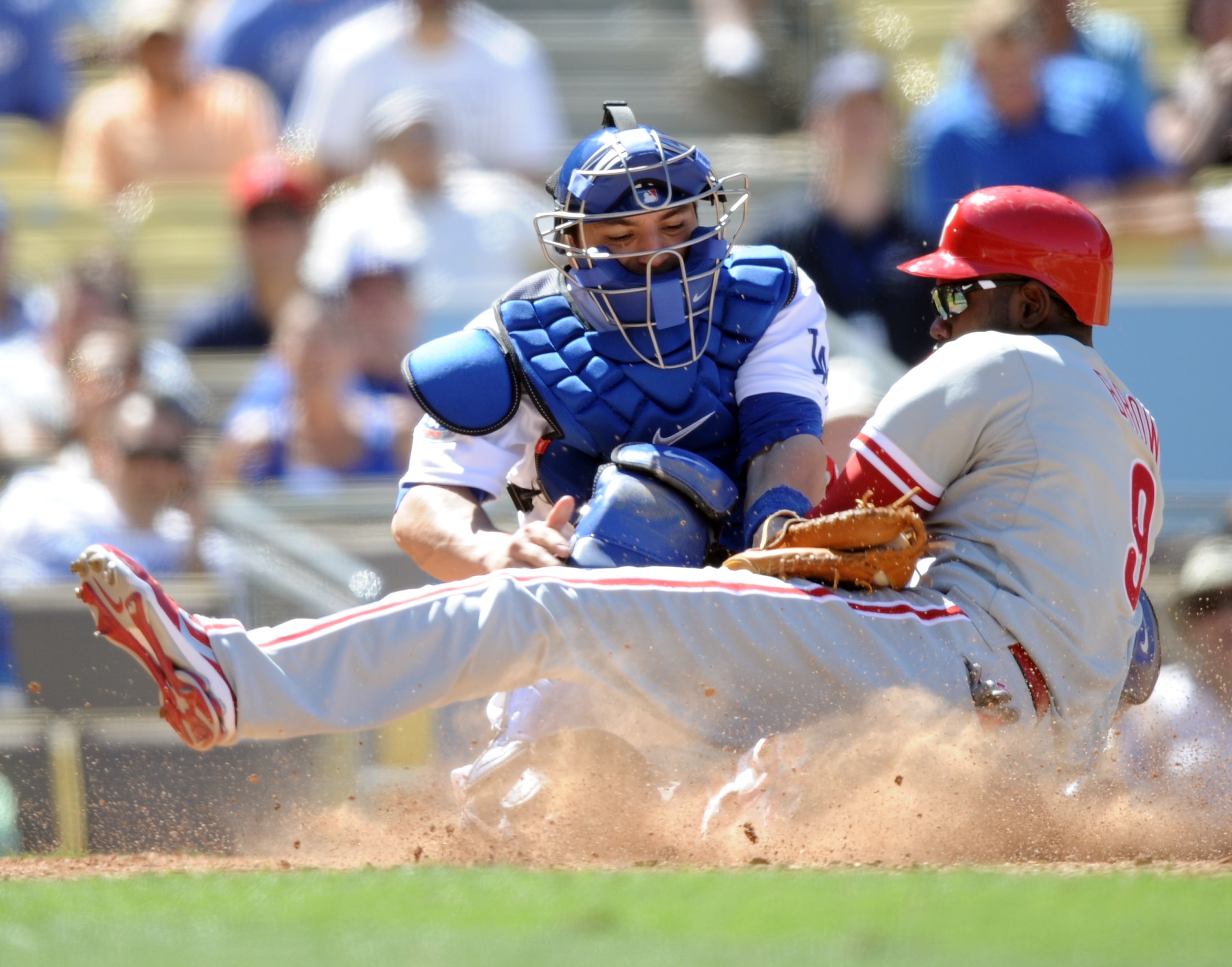 LOS ANGELES, CA - SEPTEMBER 01: Domonic Brown #9 of the Philadelphia Phillies slides safely under the tag of Rod Barajas #28 of the Los Angeles Dodgers for a 5-1 lead during the ninth inning at Dodger Stadium on September 1, 2010 in Los Angeles, Californ LOS ANGELES, CA - SEPTEMBER 01: Domonic Brown #9 of the Philadelphia Phillies slides safely under the tag of Rod Barajas #28 of the Los Angeles Dodgers for a 5-1 lead during the ninth inning at Dodger Stadium on September 1, 2010 in Los Angeles, Californ