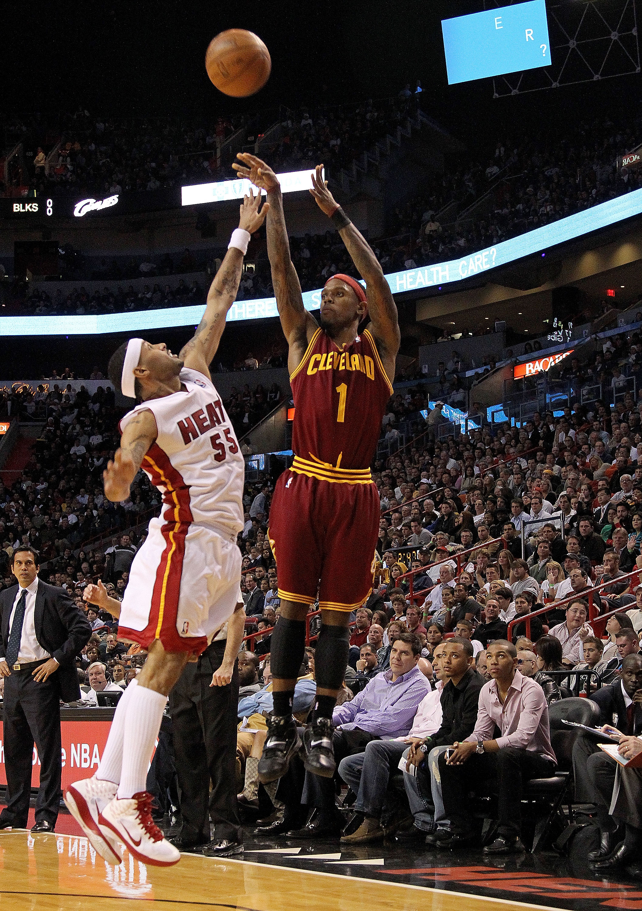 MIAMI, FL - DECEMBER 15:  Daniel Gibson #1 of the Cleveland Cavaliers shoots over Eddie House #55 of the Miami Heat  during a game at American Airlines Arena on December 15, 2010 in Miami, Florida. NOTE TO USER: User expressly acknowledges and agrees that