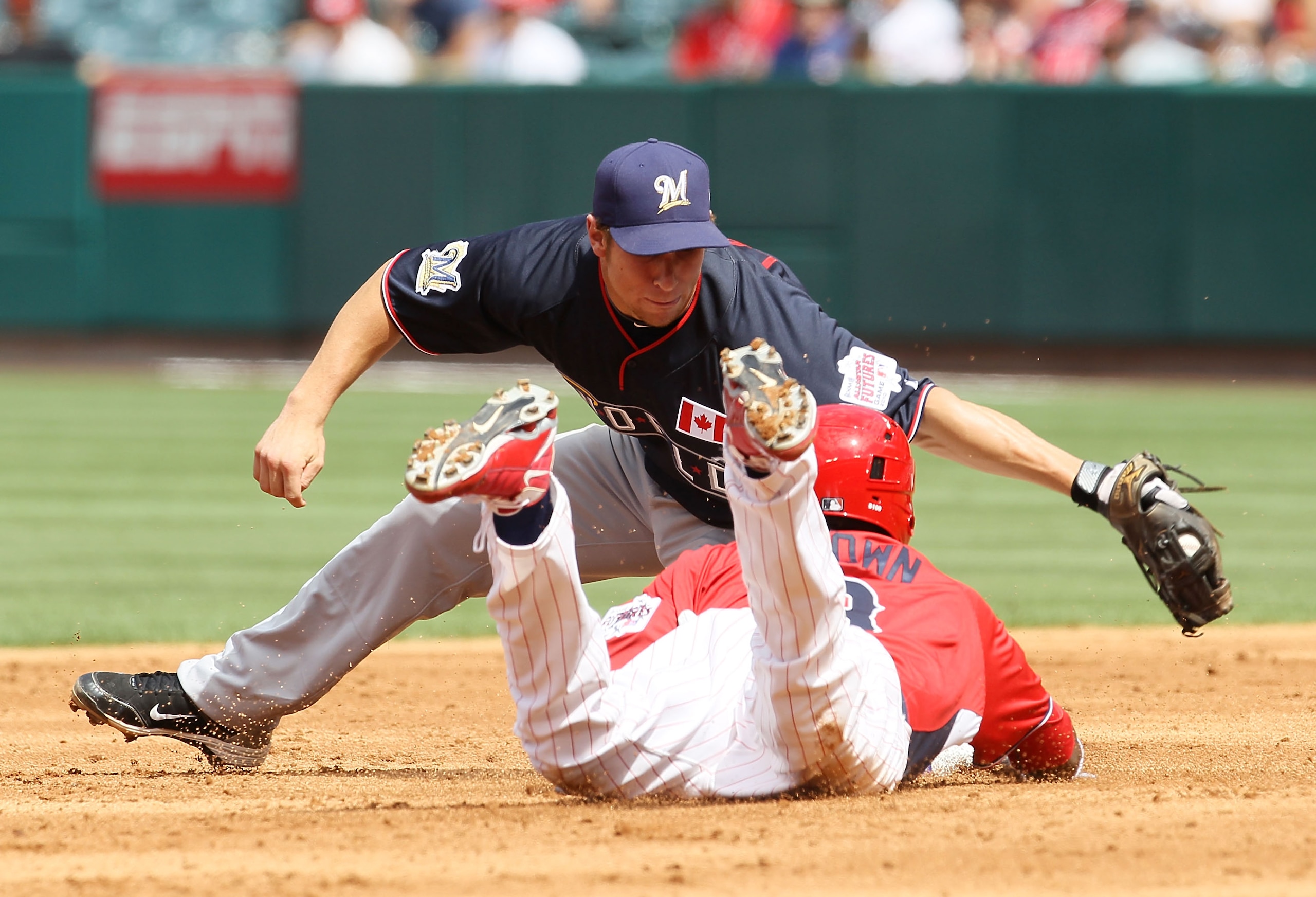 ANAHEIM, CA - JULY 11: U.S. Futures All-Star Domonic Brown #3 of the Philadelphia Phillies slides into second base safely during the 2010 XM All-Star Futures Game at Angel Stadium of Anaheim on July 11, 2010 in Anaheim, California. (Photo by Stephen Dun ANAHEIM, CA - JULY 11: U.S. Futures All-Star Domonic Brown #3 of the Philadelphia Phillies slides into second base safely during the 2010 XM All-Star Futures Game at Angel Stadium of Anaheim on July 11, 2010 in Anaheim, California. (Photo by Stephen Dun