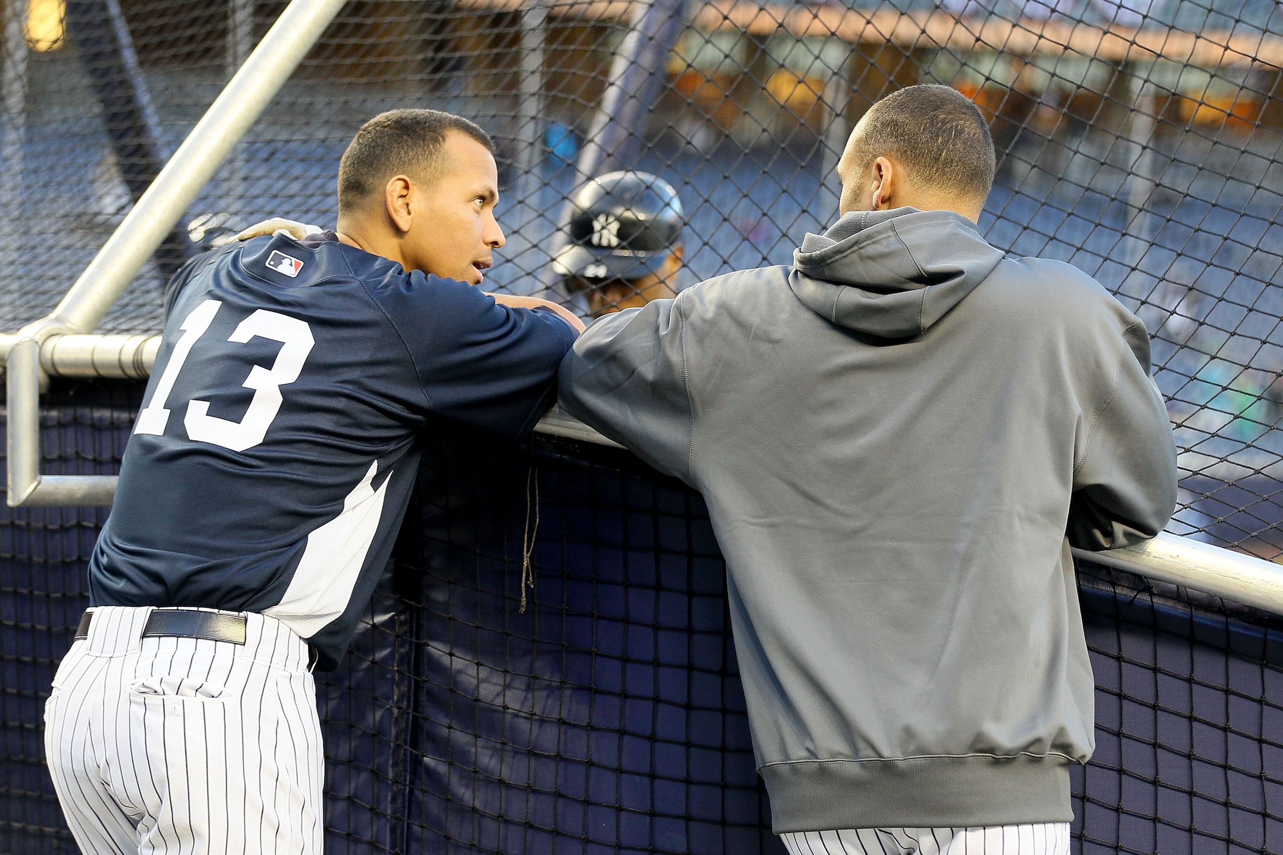 NEW YORK - OCTOBER 09:  (L-R) Alex Rodriguez #13 and Derek Jeter #2 of the New York Yankees talk behind the batting cage against the Minnesota Twins during Game Three of the ALDS part of the 2010 MLB Playoffs at Yankee Stadium on October 9, 2010 in the Br