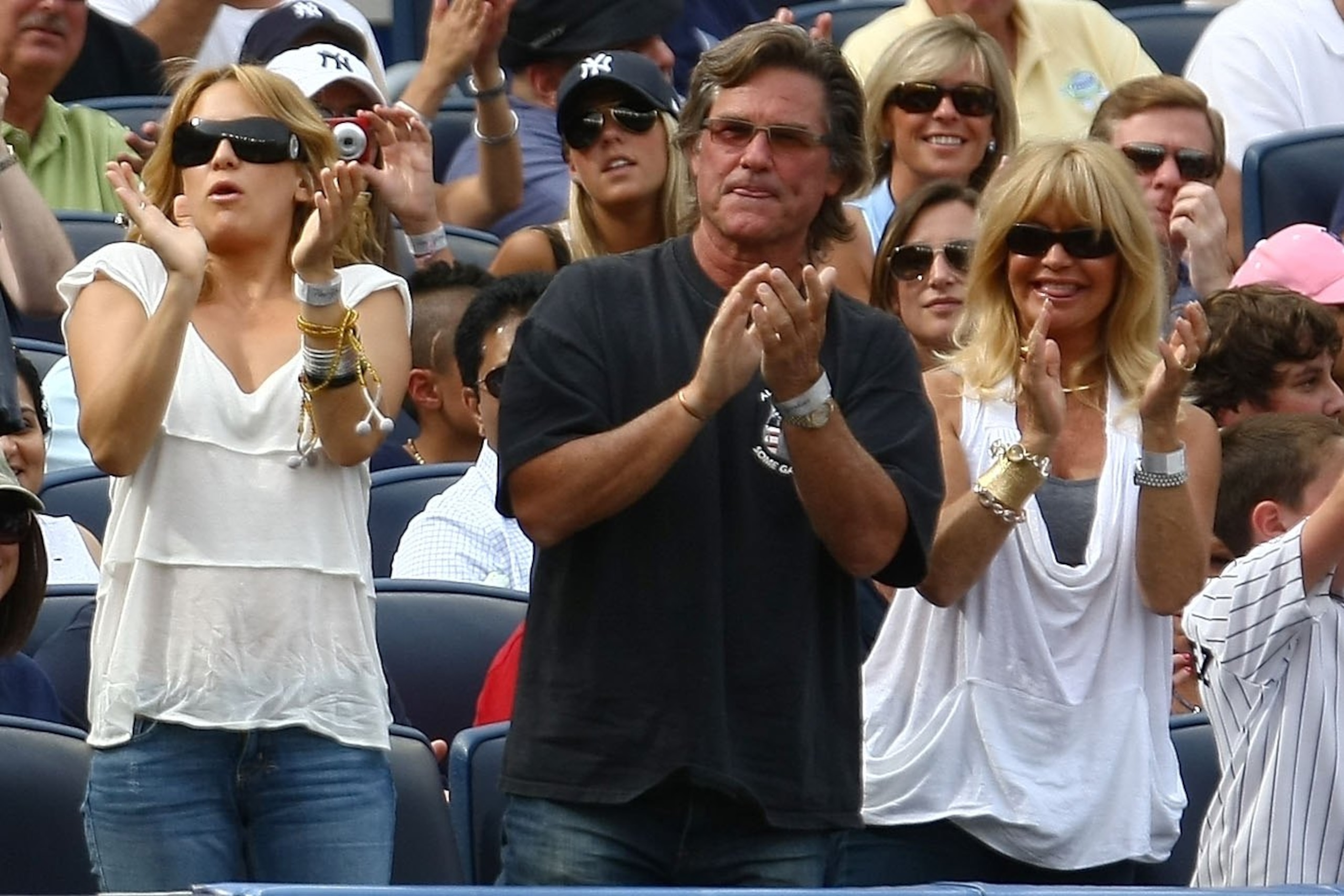 NEW YORK - AUGUST 08:  Kate Hudson, Kurt Russell and Goldie Hawn clap as Alex Rodriguez of the New York Yankees steps up to bat against the Boston Red Sox during their game on August 8, 2009 at Yankee Stadium in the Bronx borough of New York City.  (Photo
